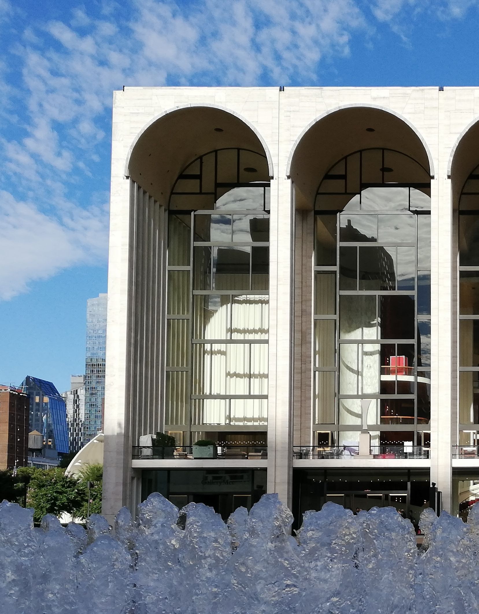 Exterior of architecture of building with fountain in foreground