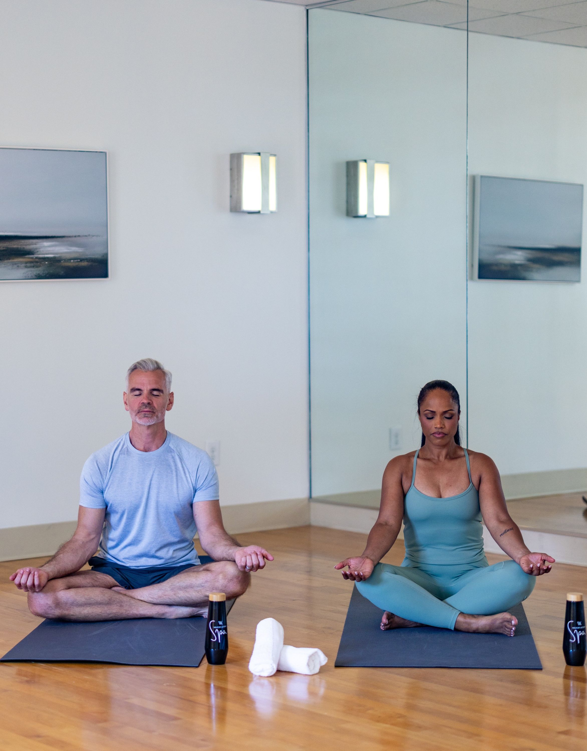 Couple Meditating in Fitness Center