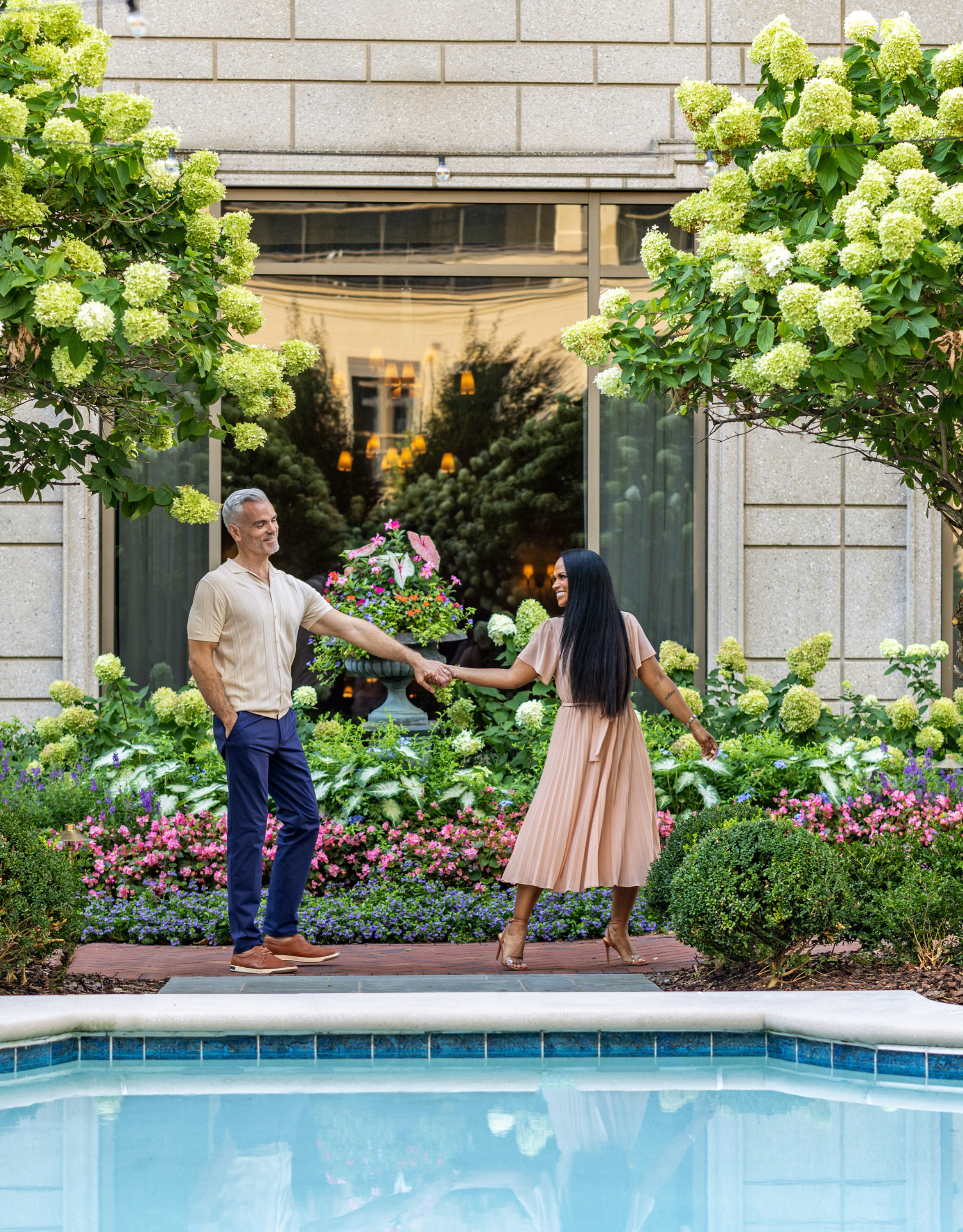 Couple taking Garden Stroll by the Outdoor Pool