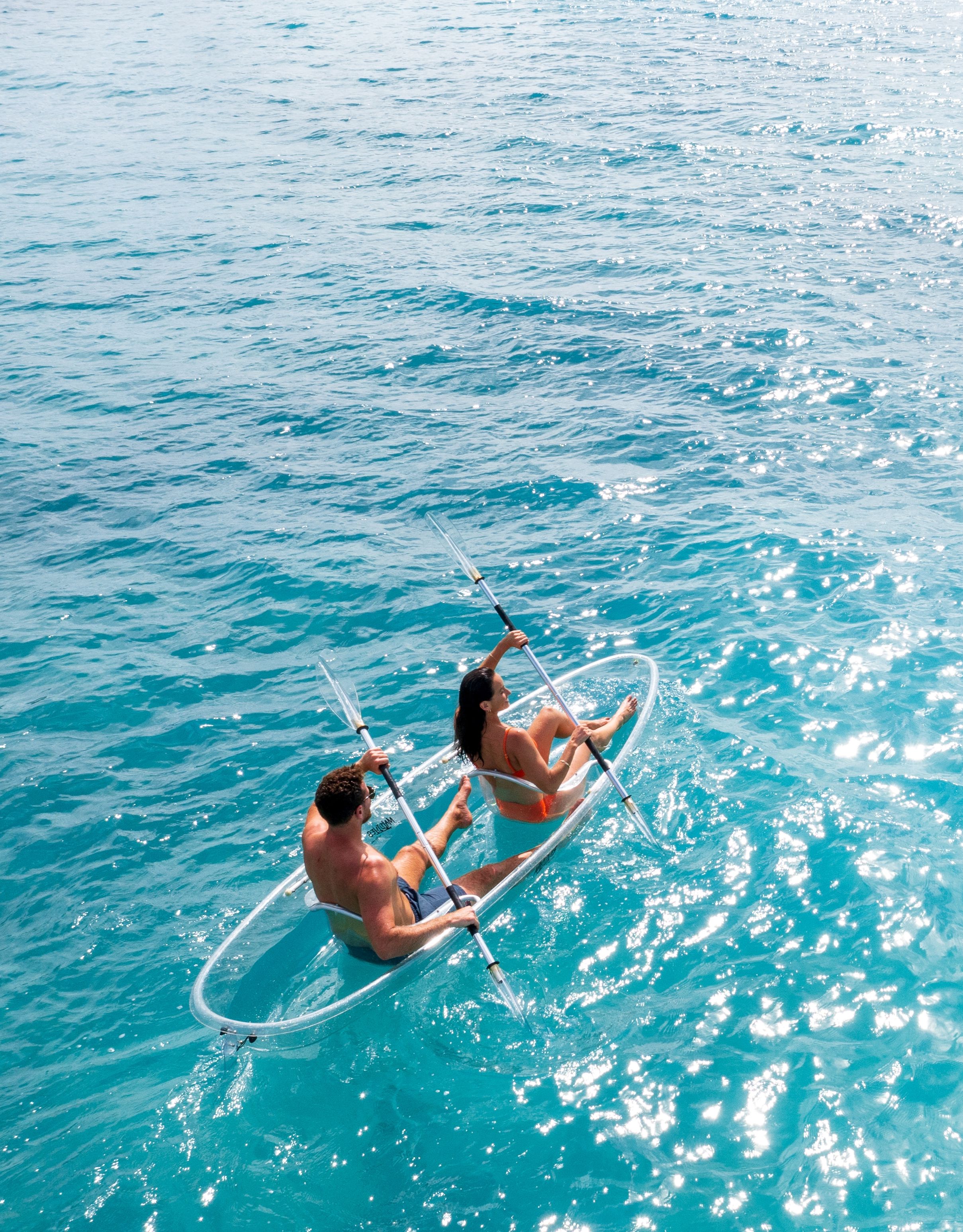 couple kayaking in the ocean