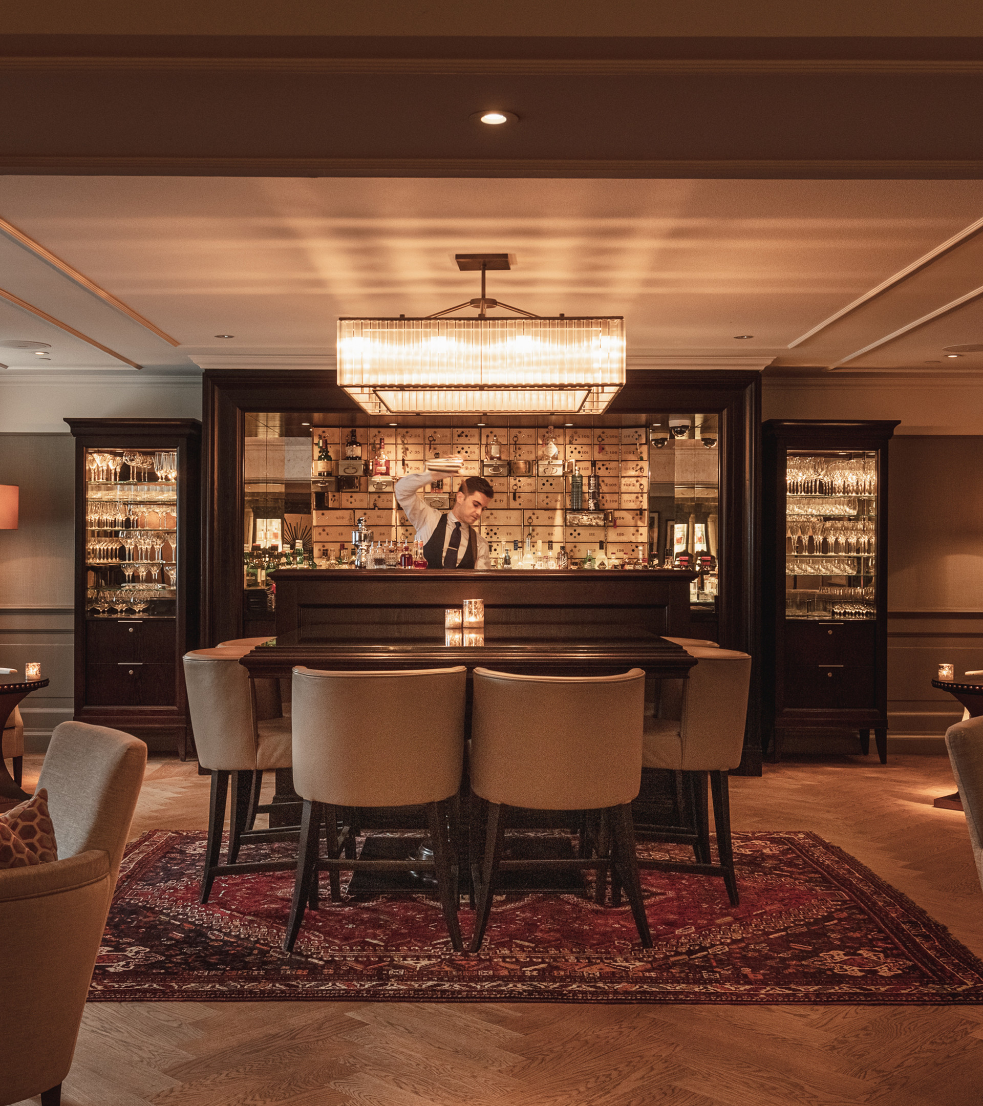 Vault Bar with seating and bartender