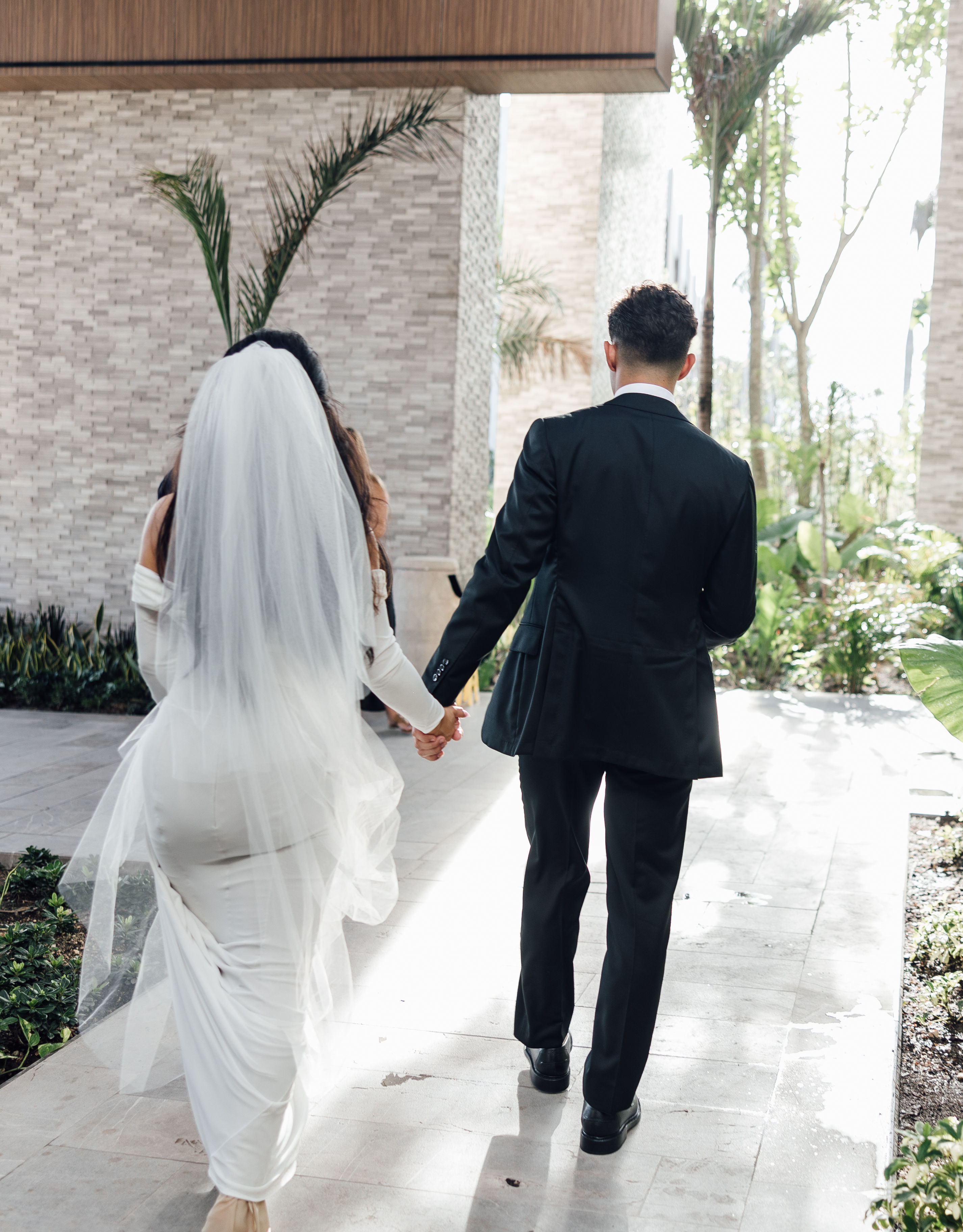 bride and groom walking away
