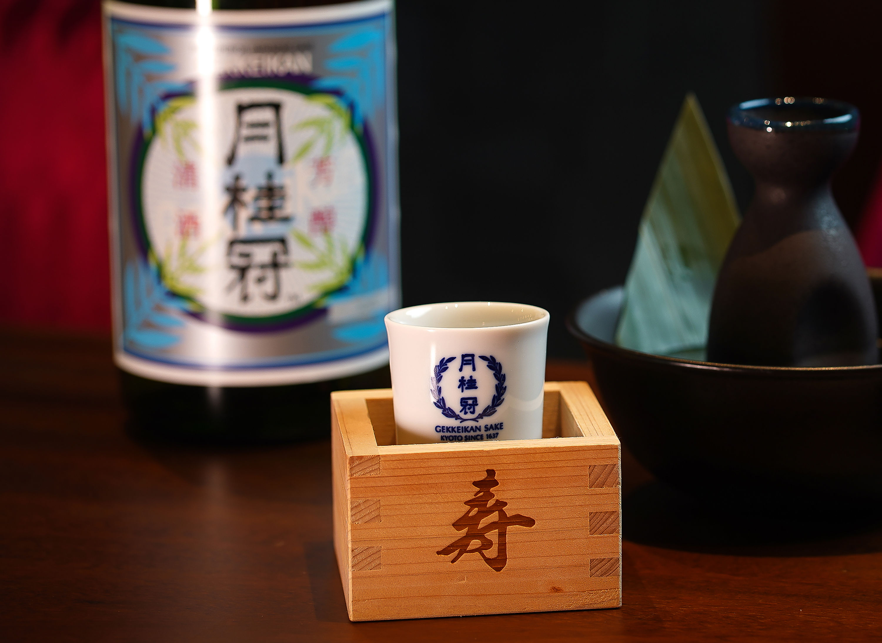 Beverages on table, with small glasses and wooden box