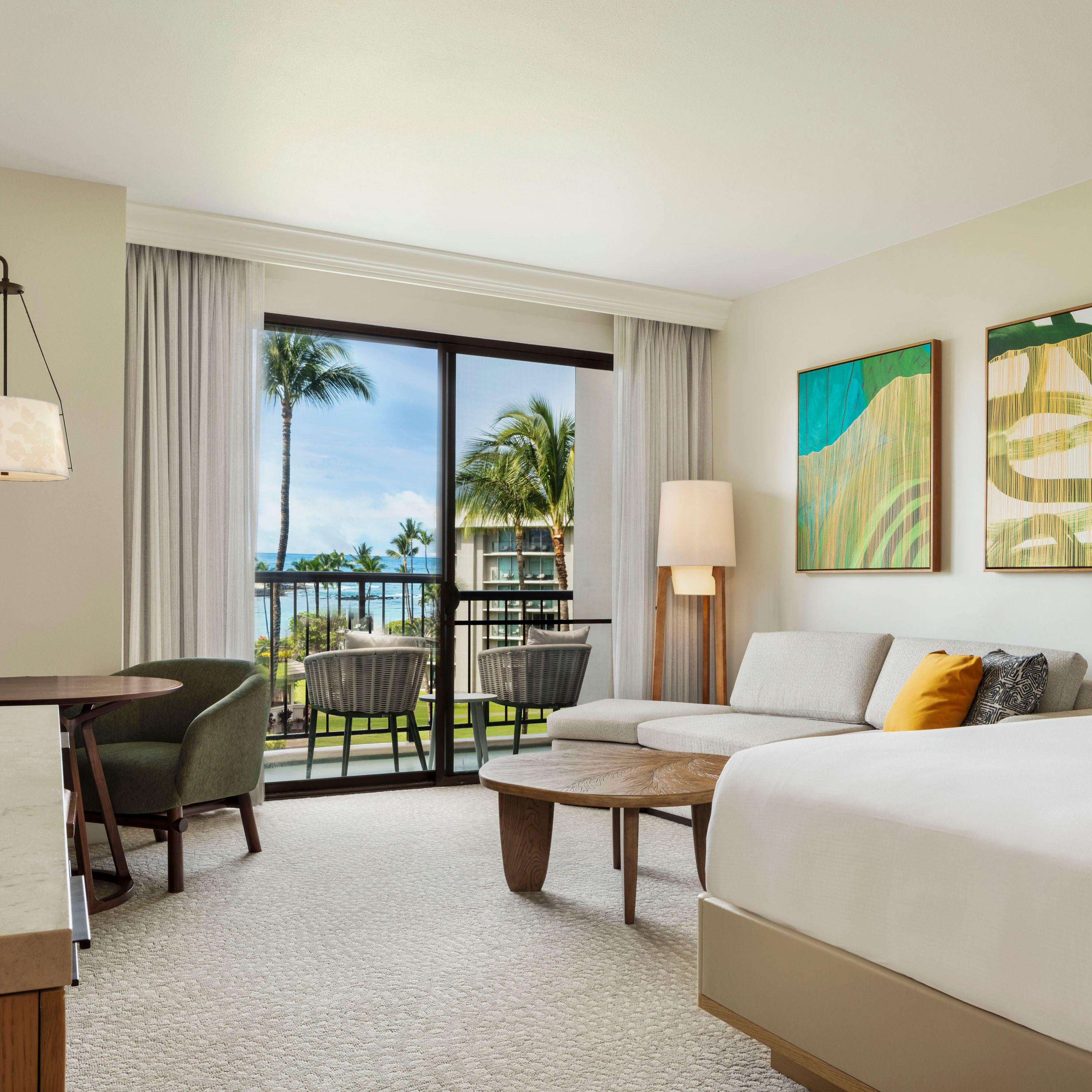 Guest room with bed, seating area and access to balcony