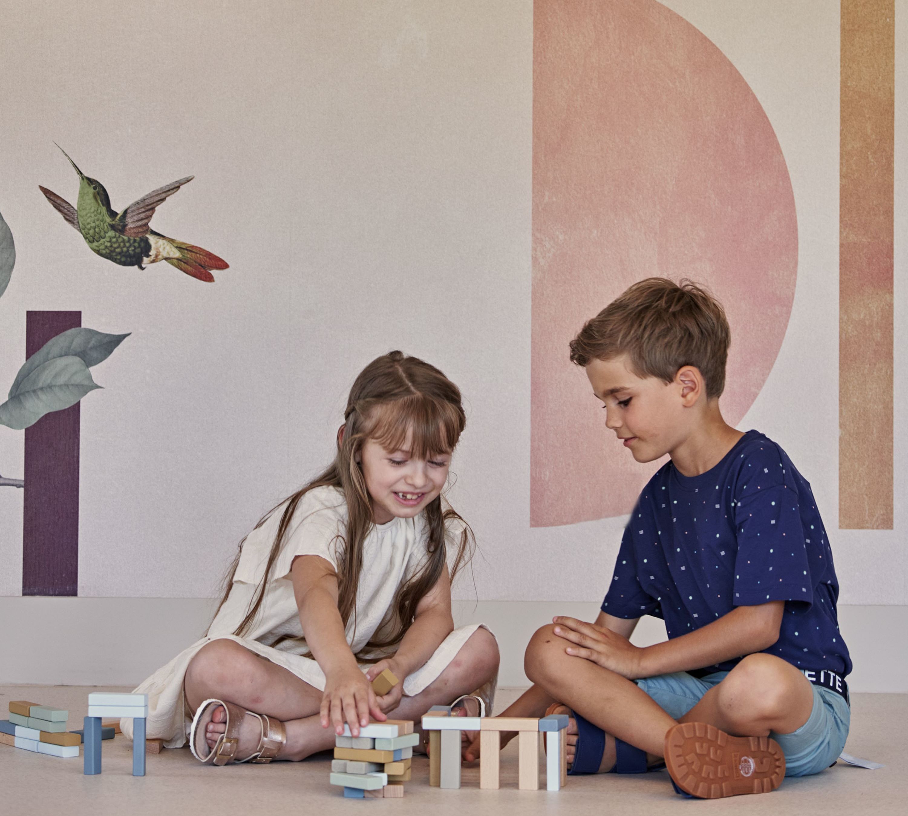 Boy and Girl Playing with Jenga BLocks