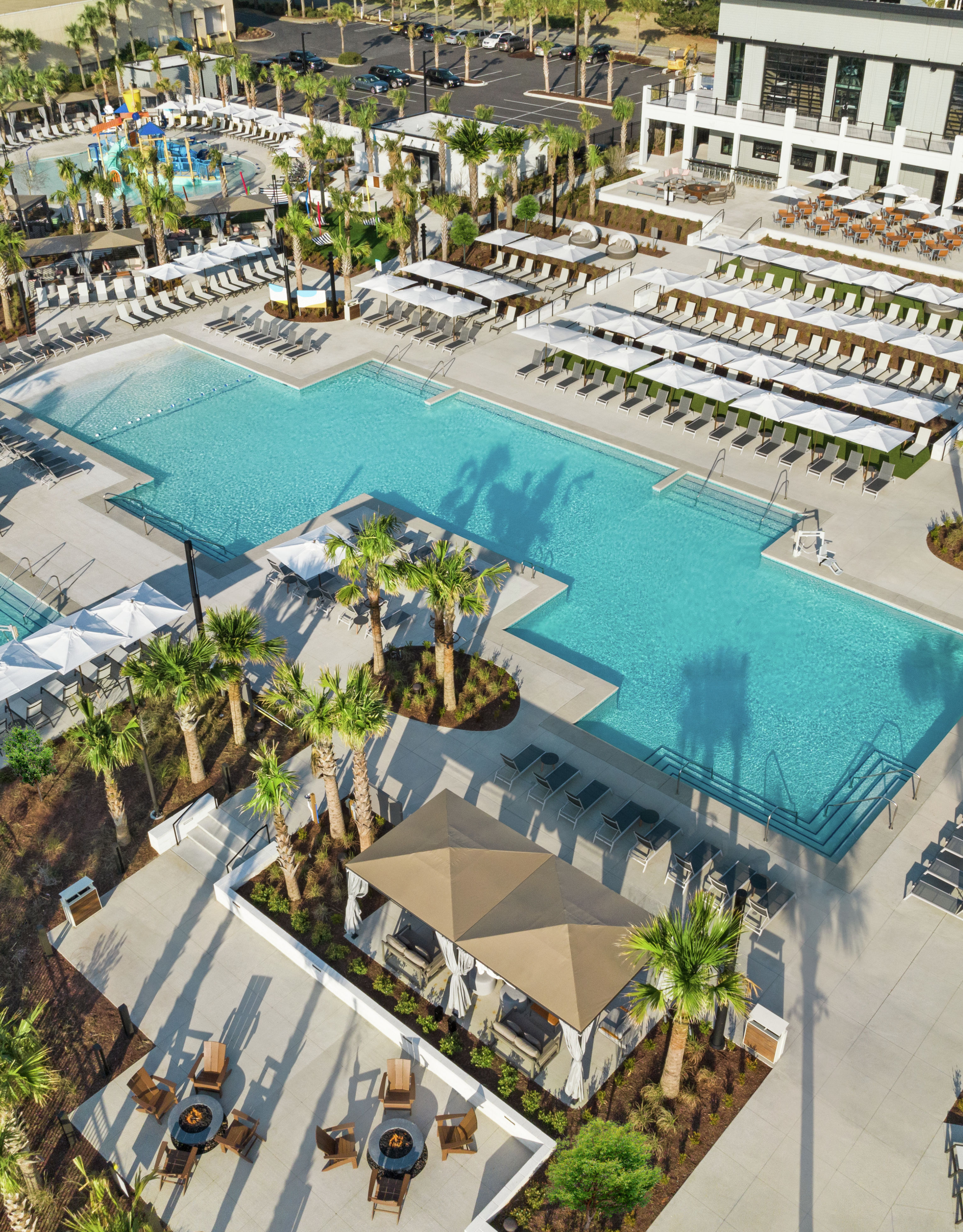 Aerial View of large outdoor pools, hot tub and kids splash area