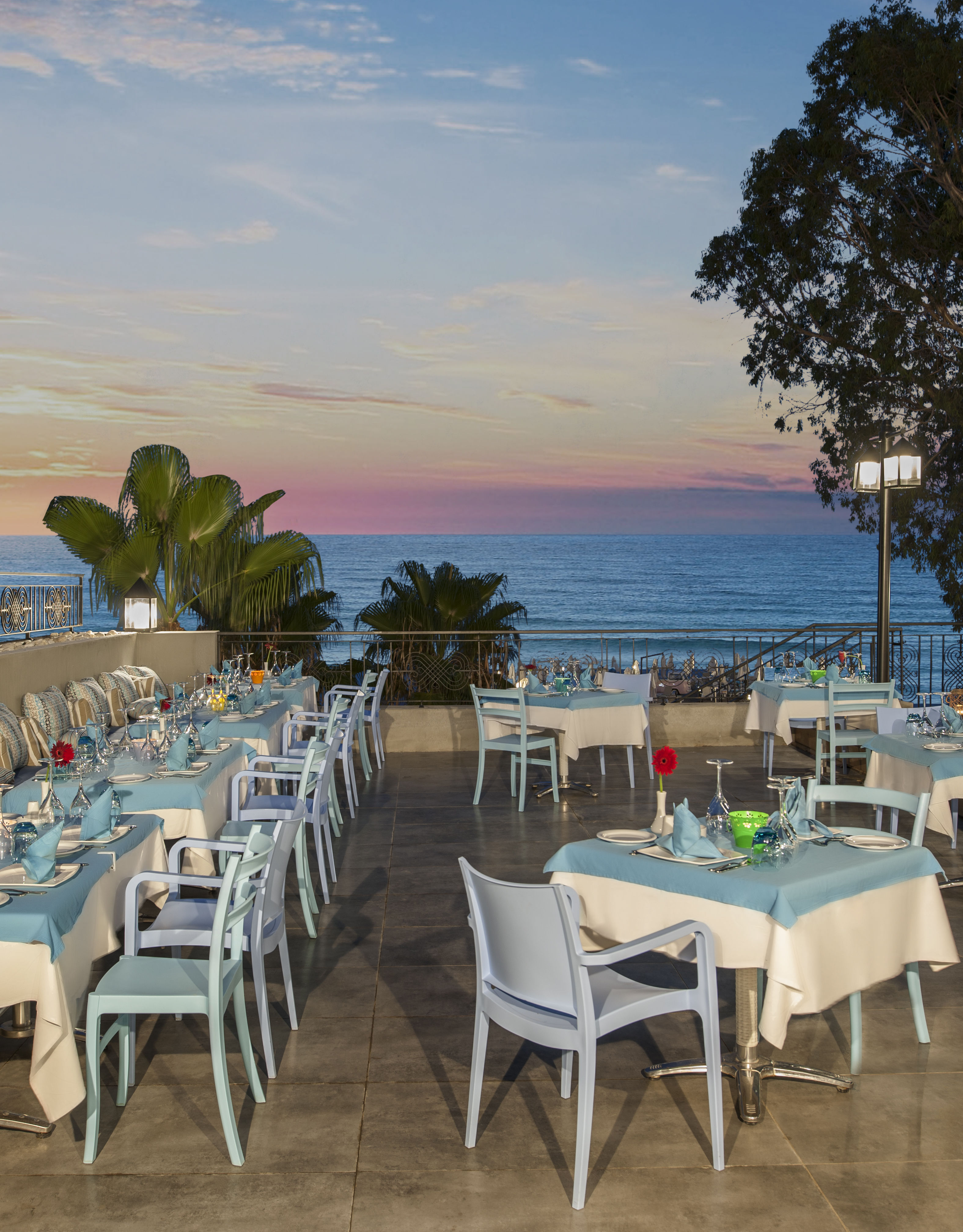 Tables in Terrace of Mediterranean Breeze Restaurant with Sea View