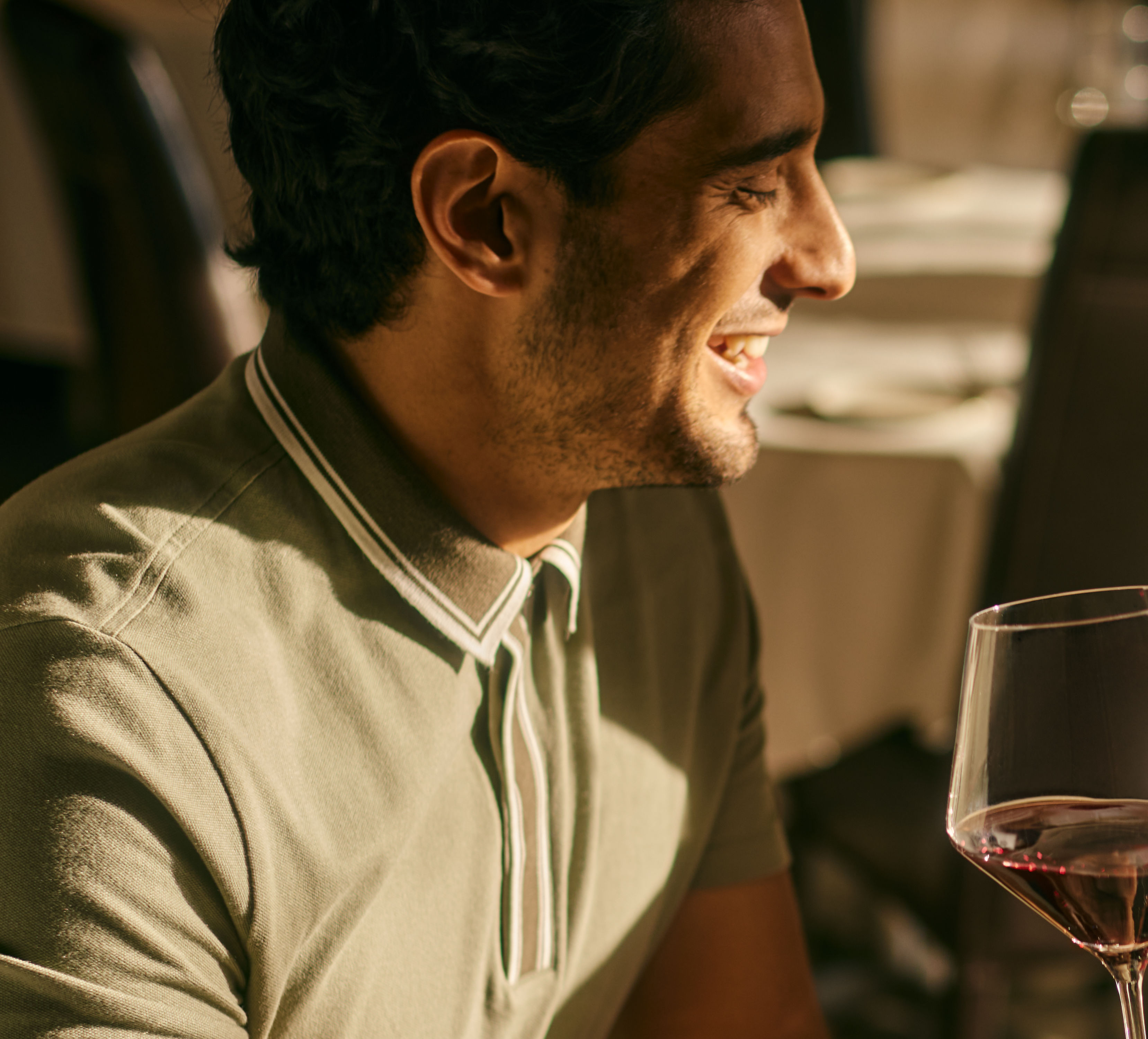 Couple enjoying a drink and meal at a table