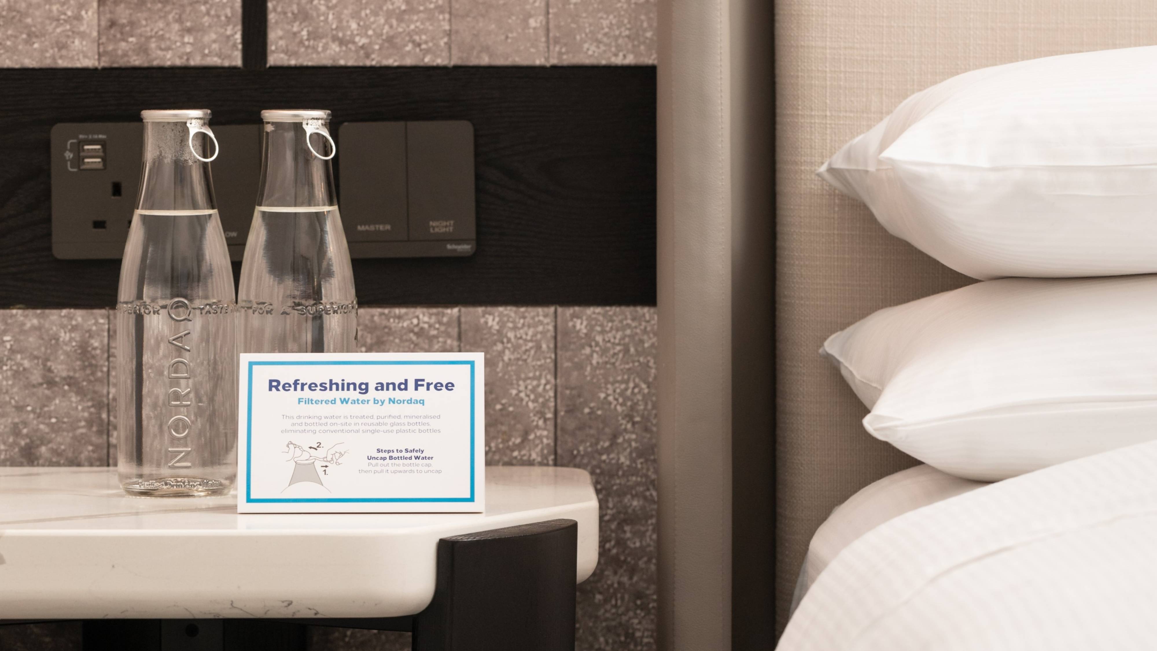 filtered bottles of water in guestroom