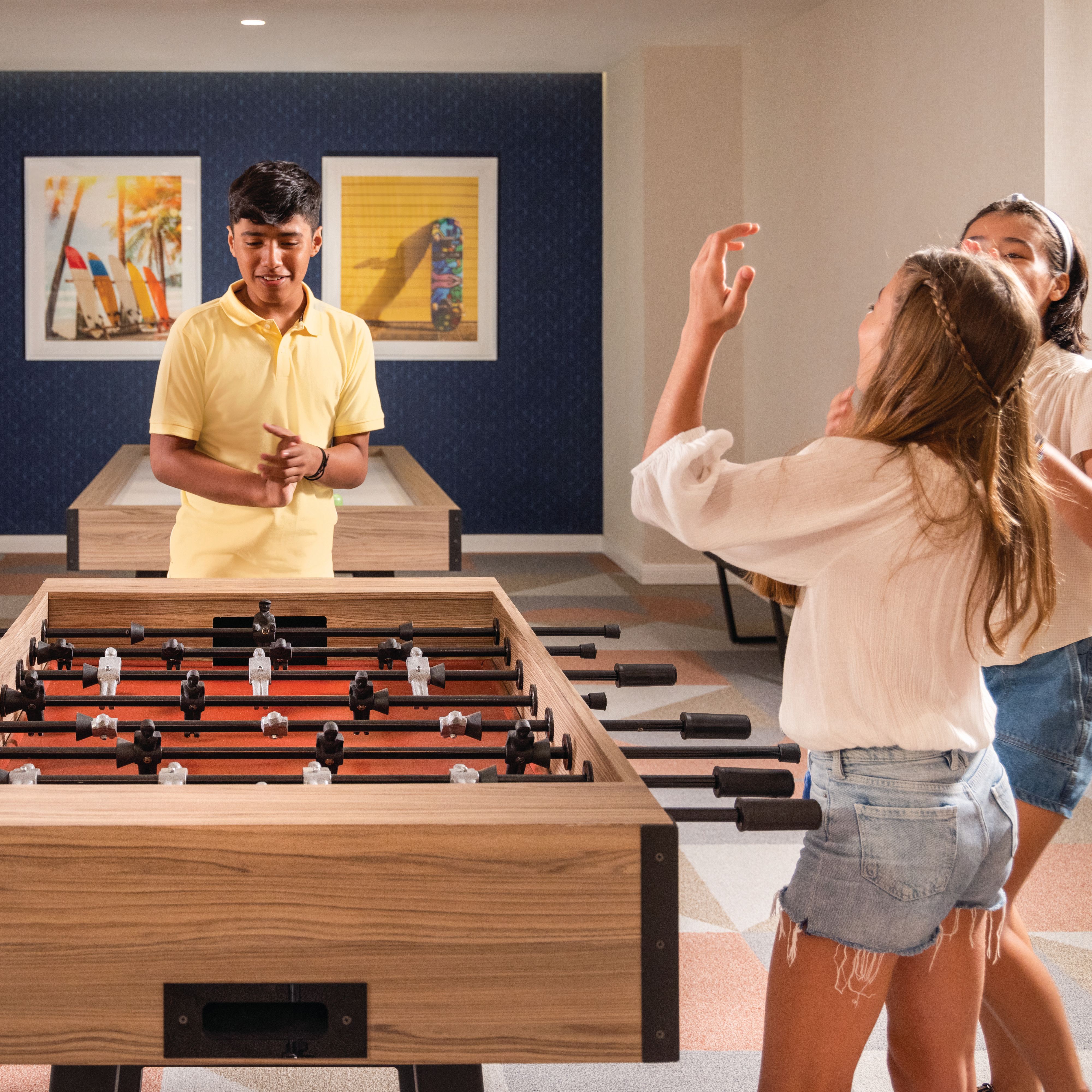 Children playing foosball