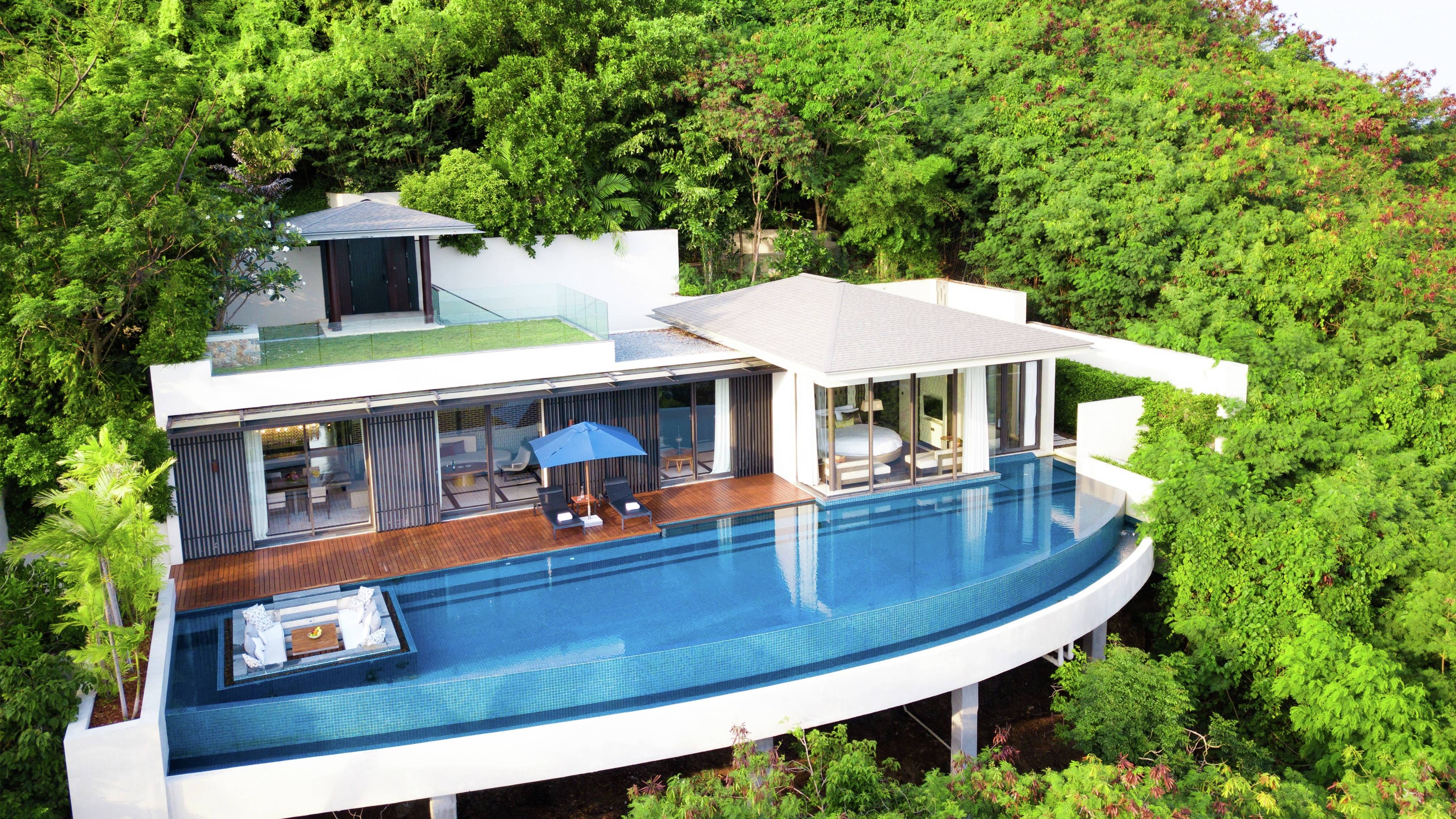 Exterior of villa surrounded by trees