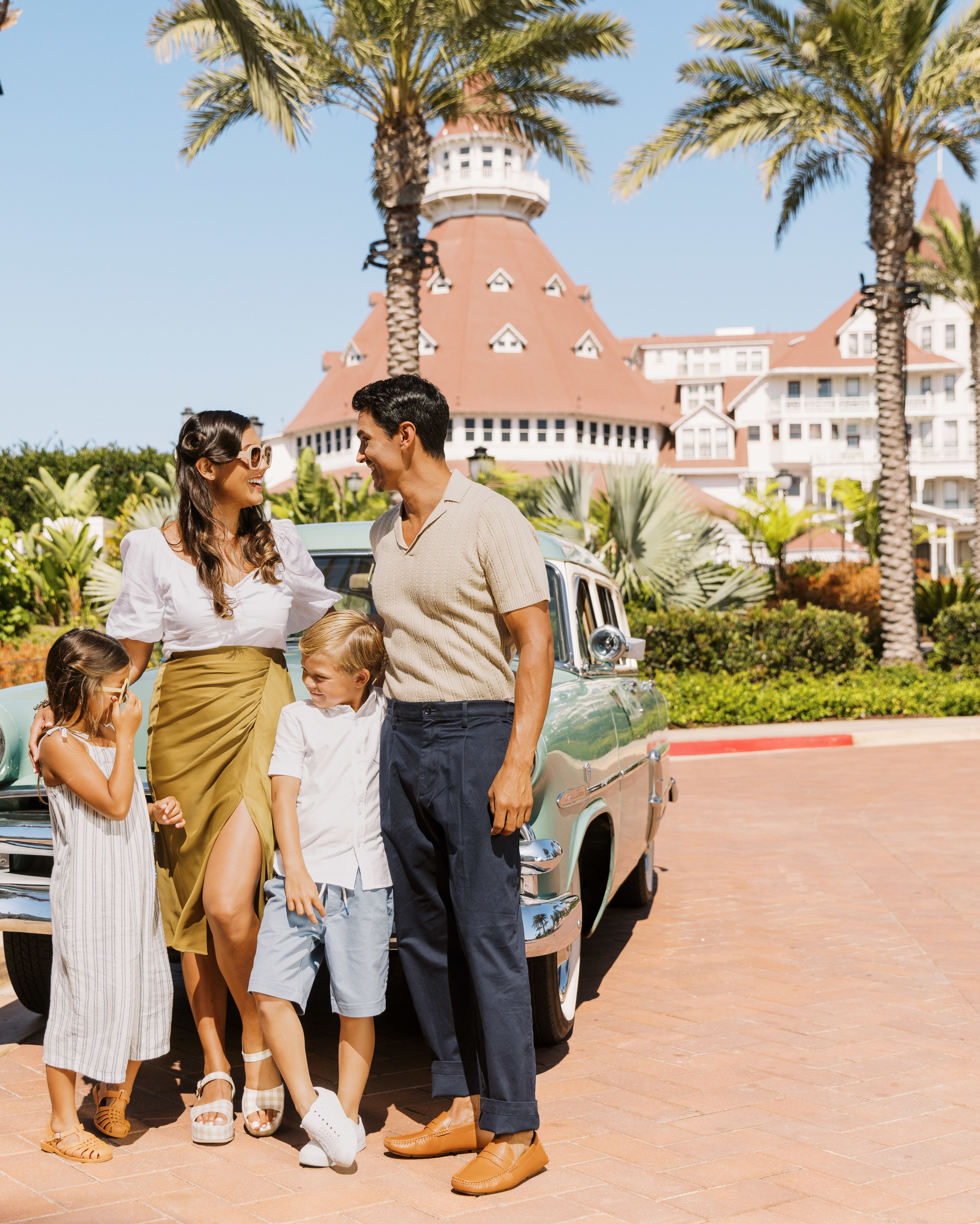 family standing outside of hotel