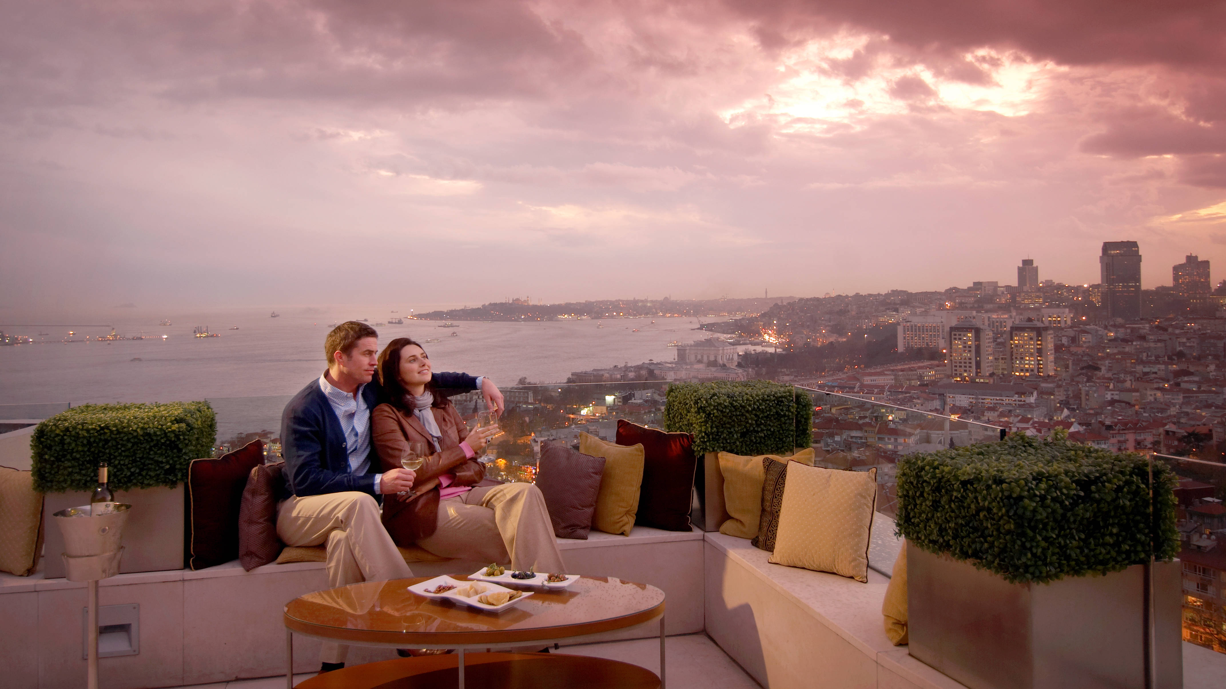Couple Sitting on Presidential Suite Balcony