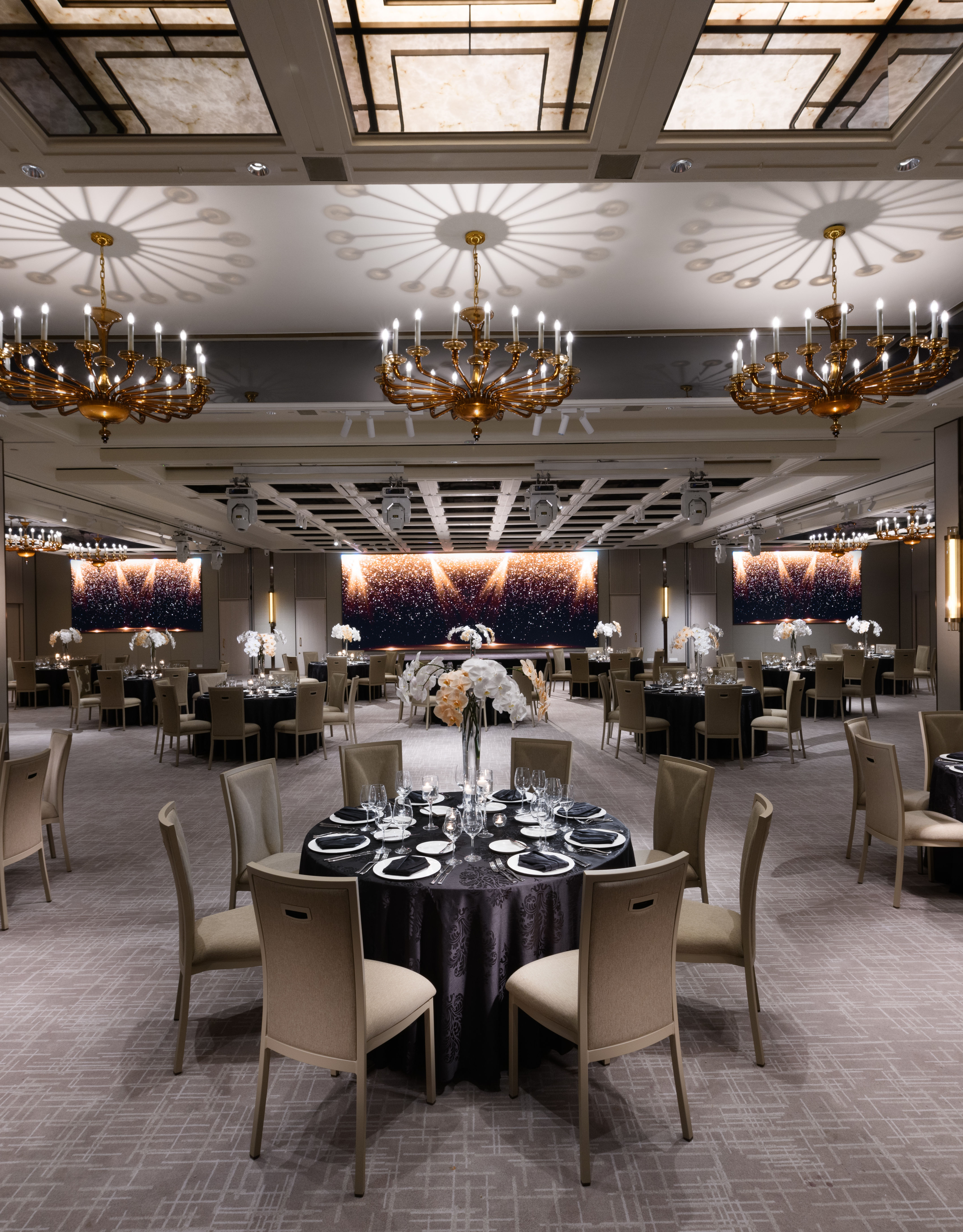 Royal Pavilion Ballroom with round tables and chandeliers