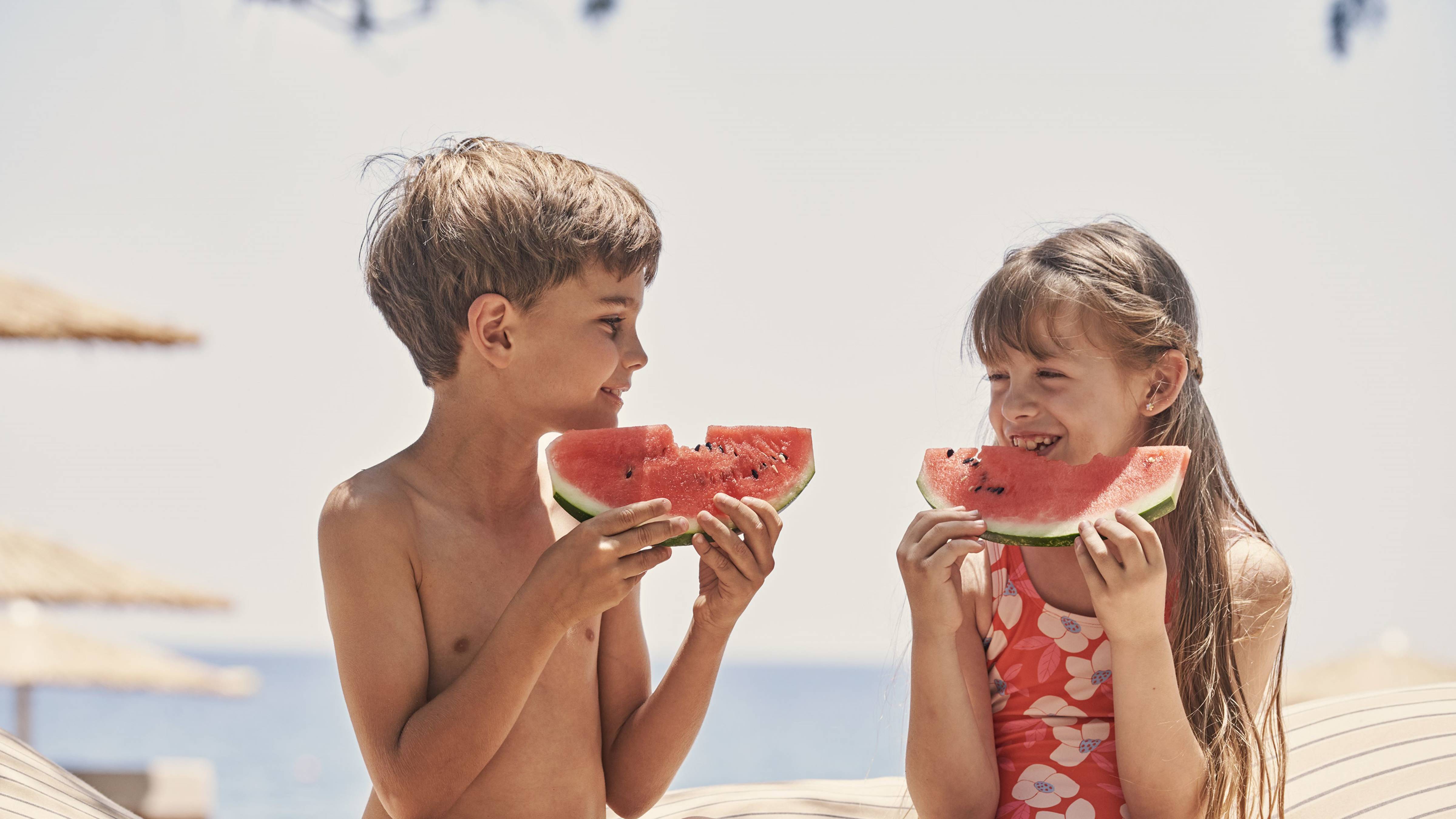 Kids Eating Watermelon at the Beach
