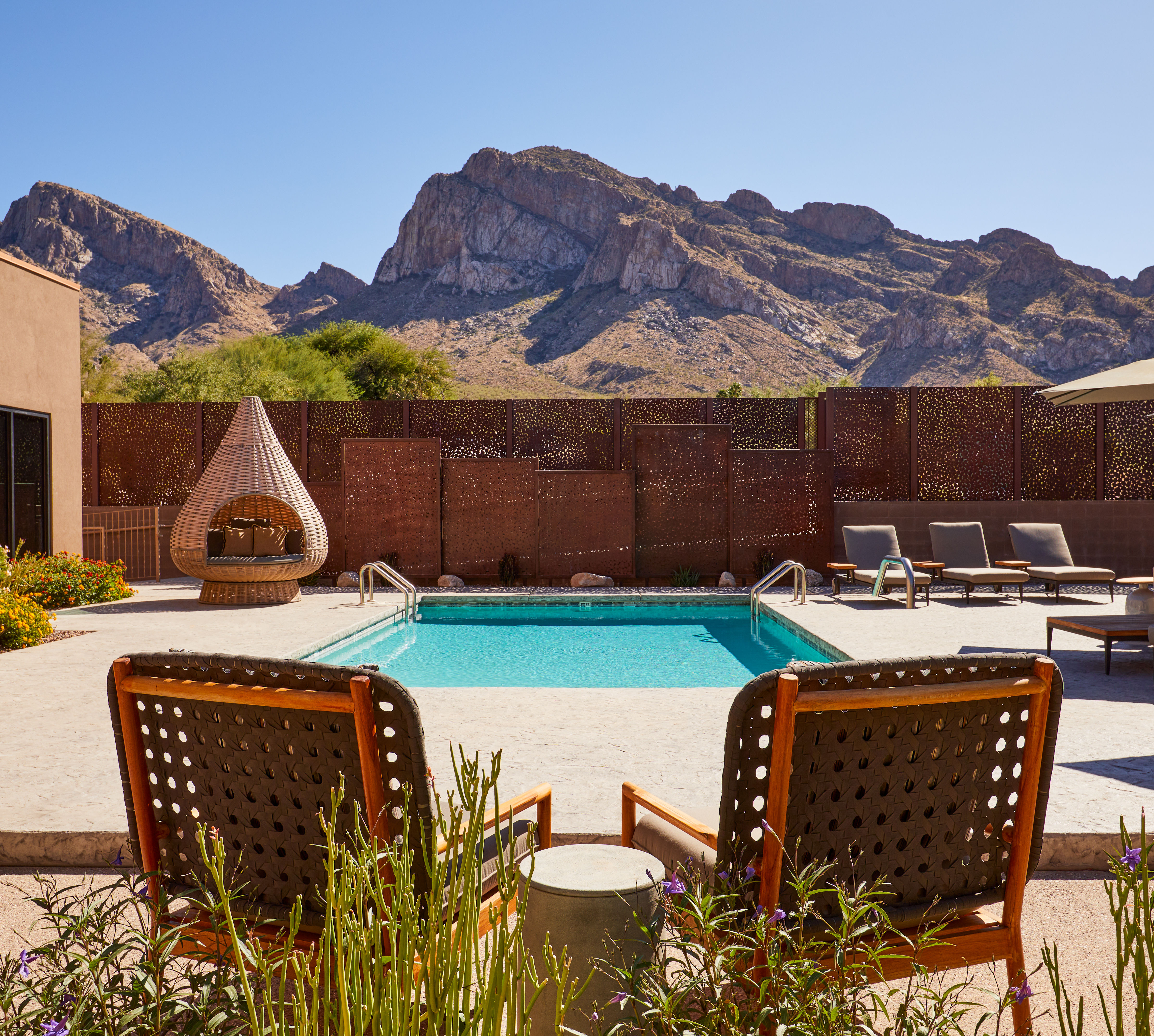 Outdoor Pool with Lounge Chairs and Sitting Area at SpaWell