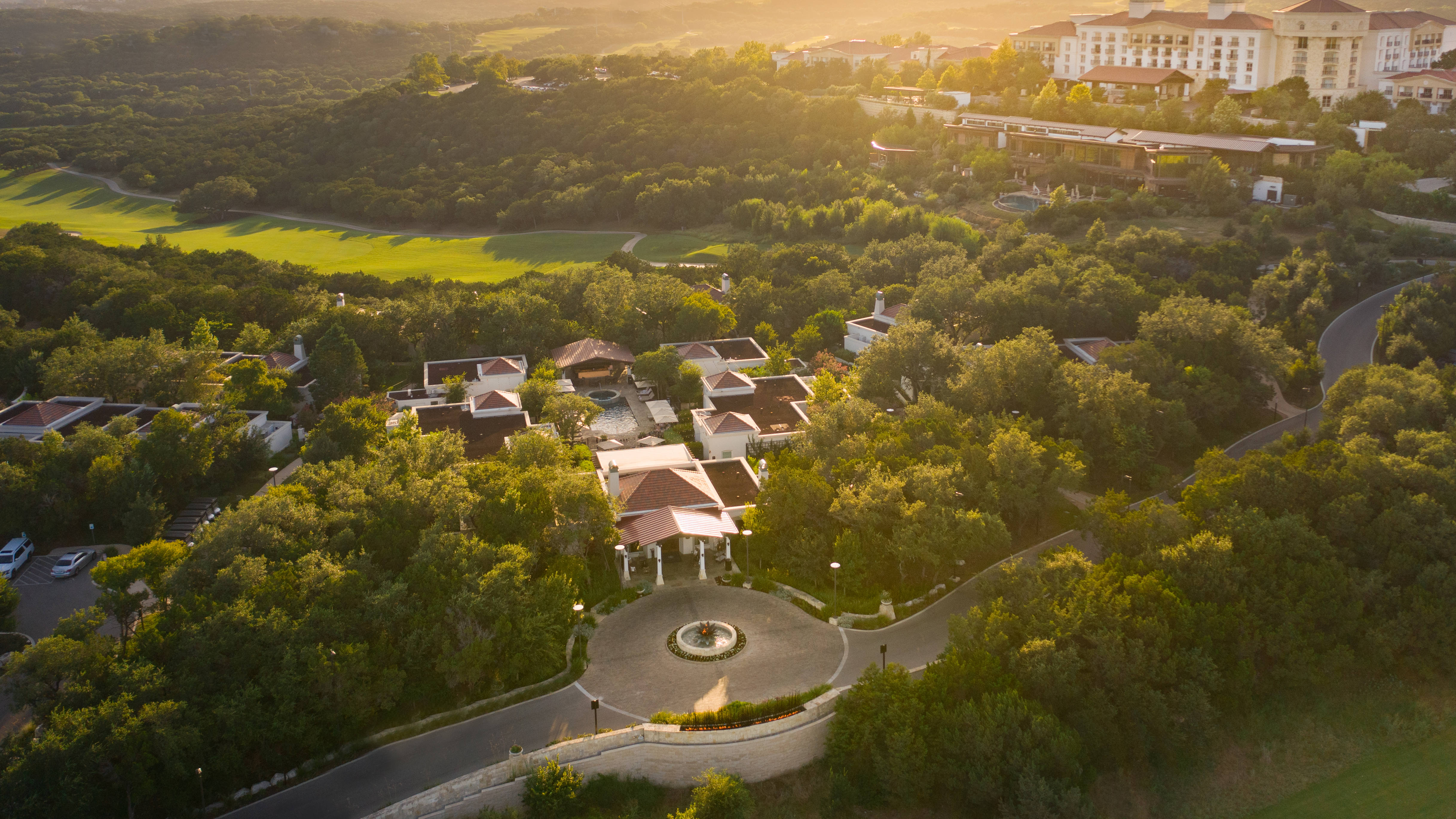 Aerial view of La Cantera Resort with sun coming over horizon
