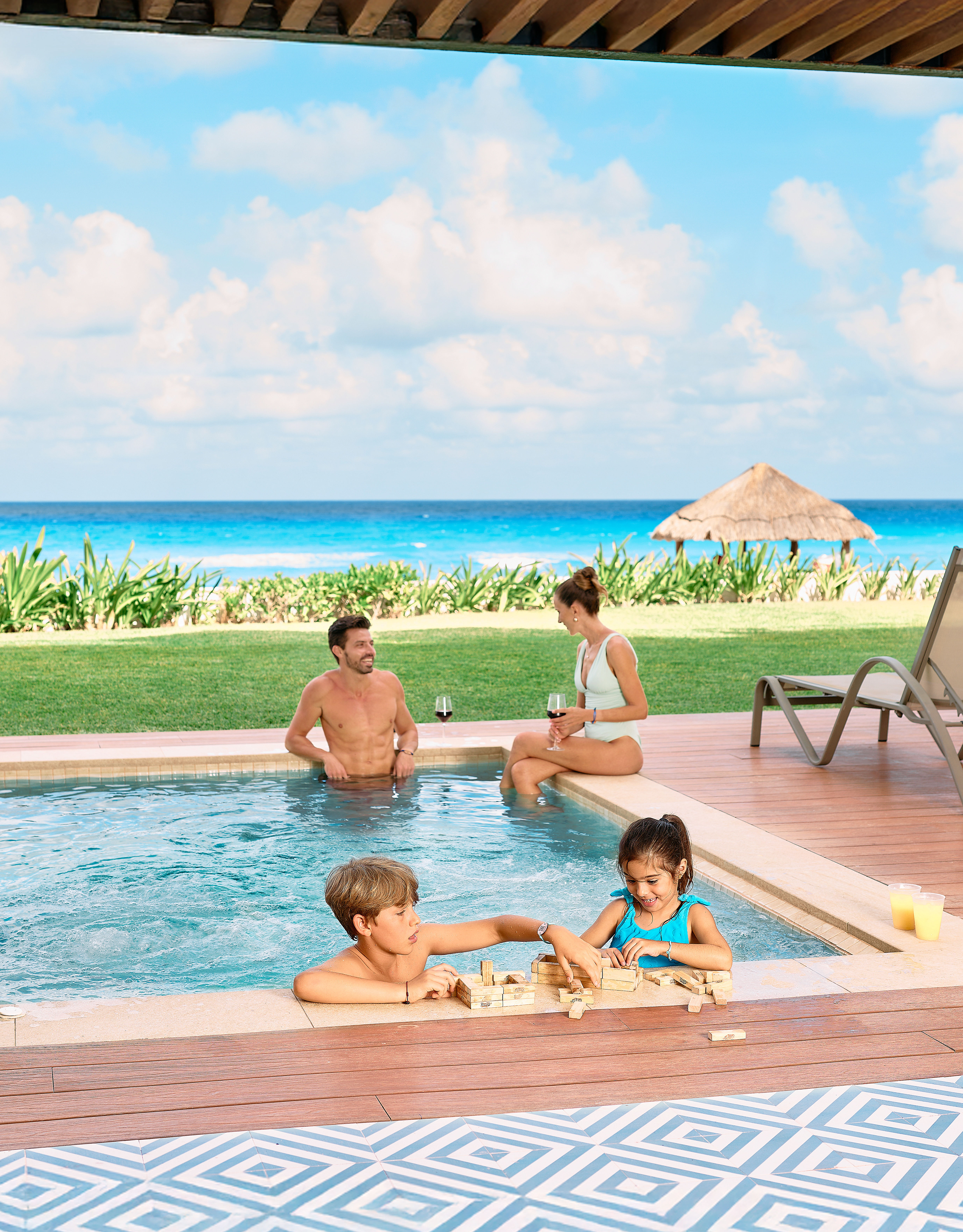 Family playing in plunge pool in the suite.