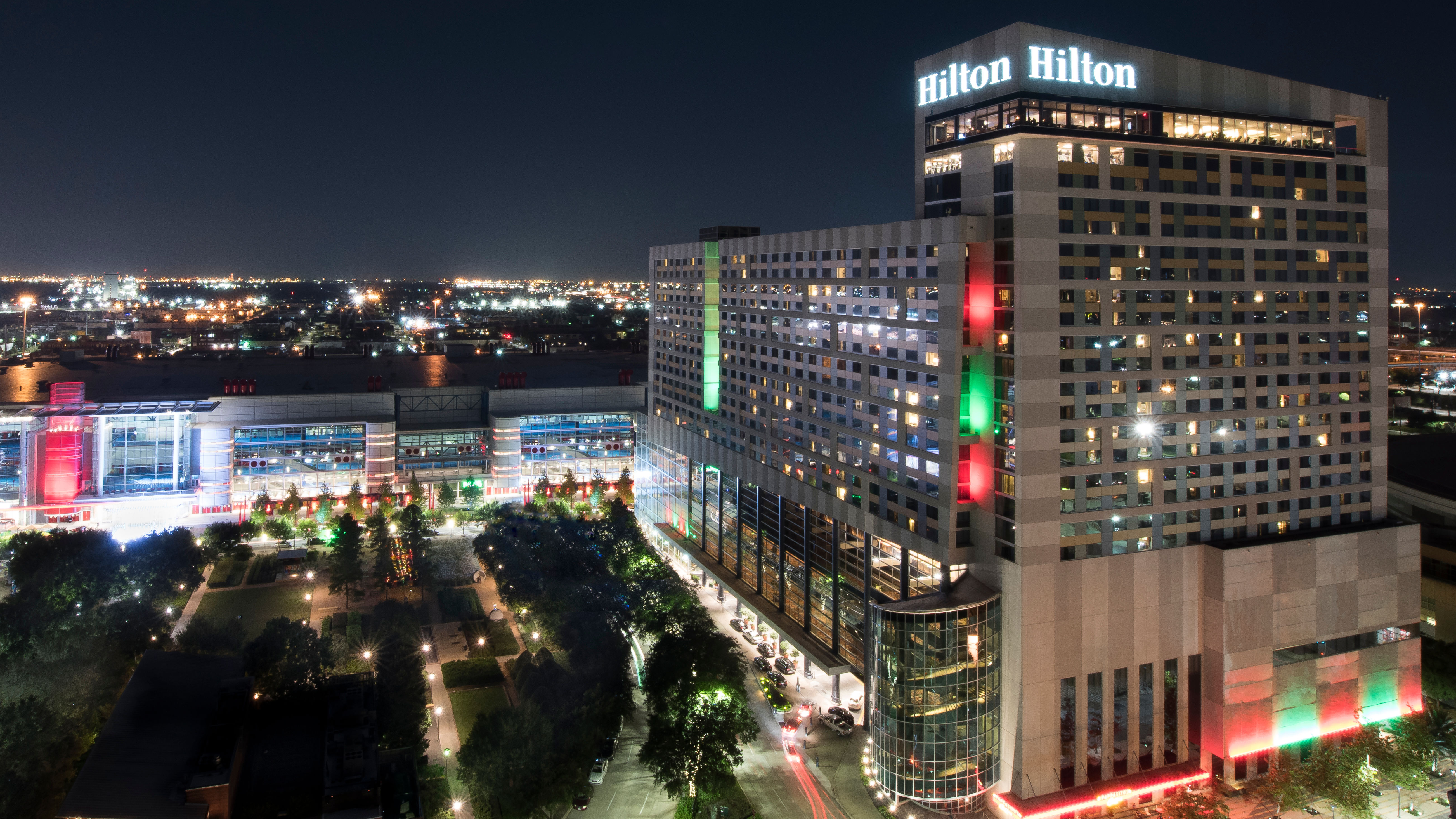 Hilton Hotel Exterior Lit with Green and Red Lights