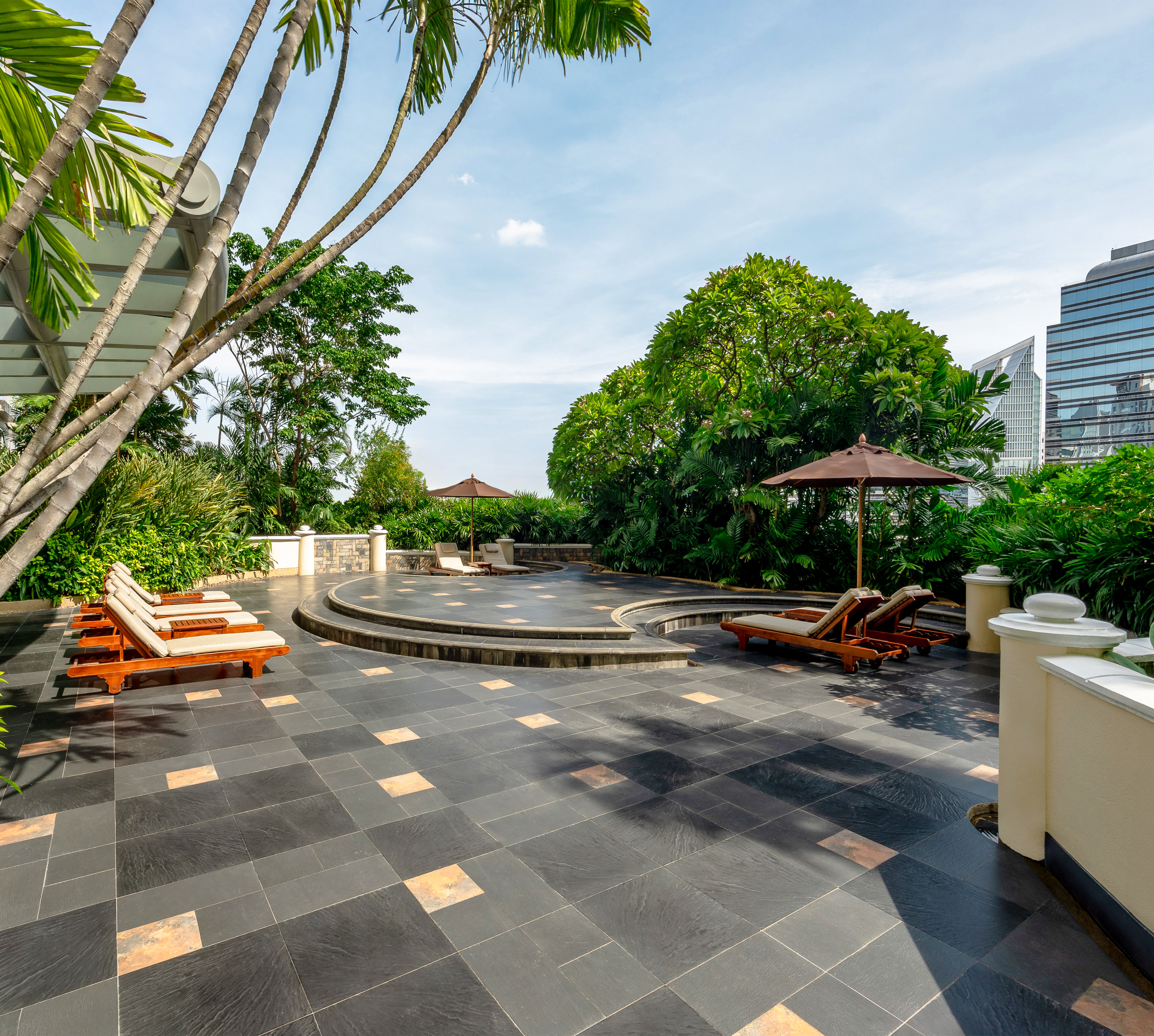 Sun Deck Area with Lounge Chairs and Umbrella
