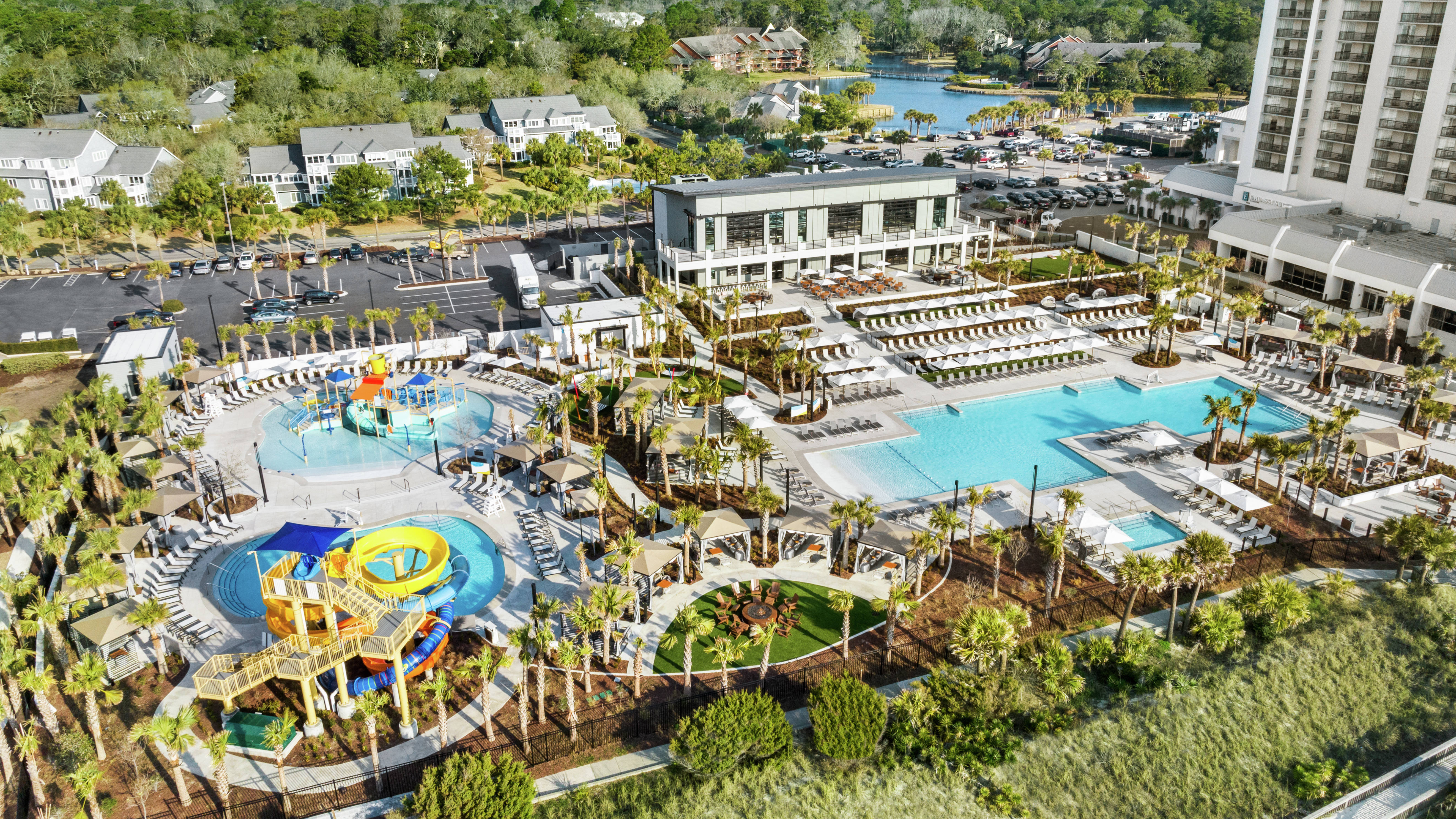Aerial view of hotel grounds featuring large pools and kids splash area