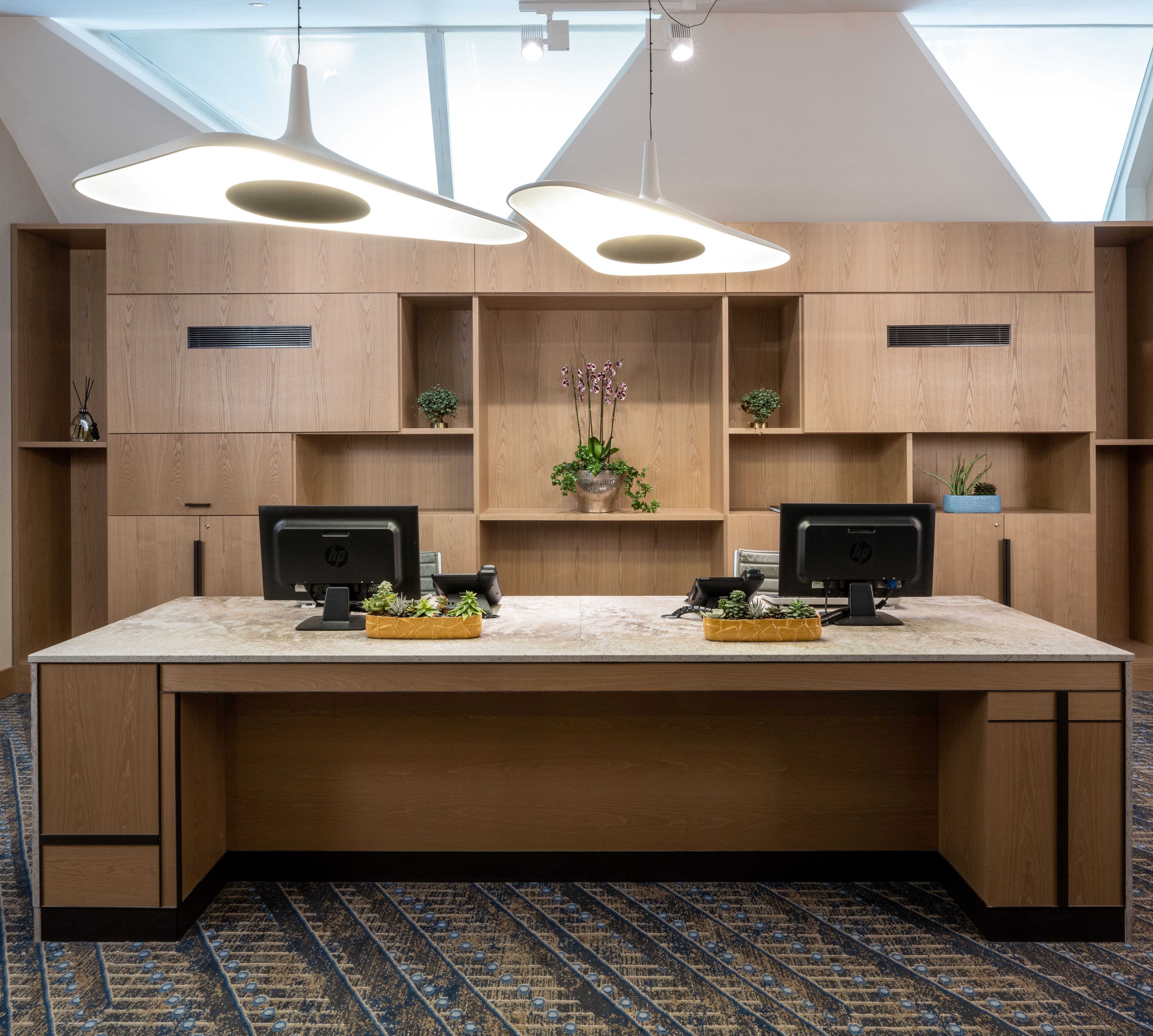business center desk, computers, tv
