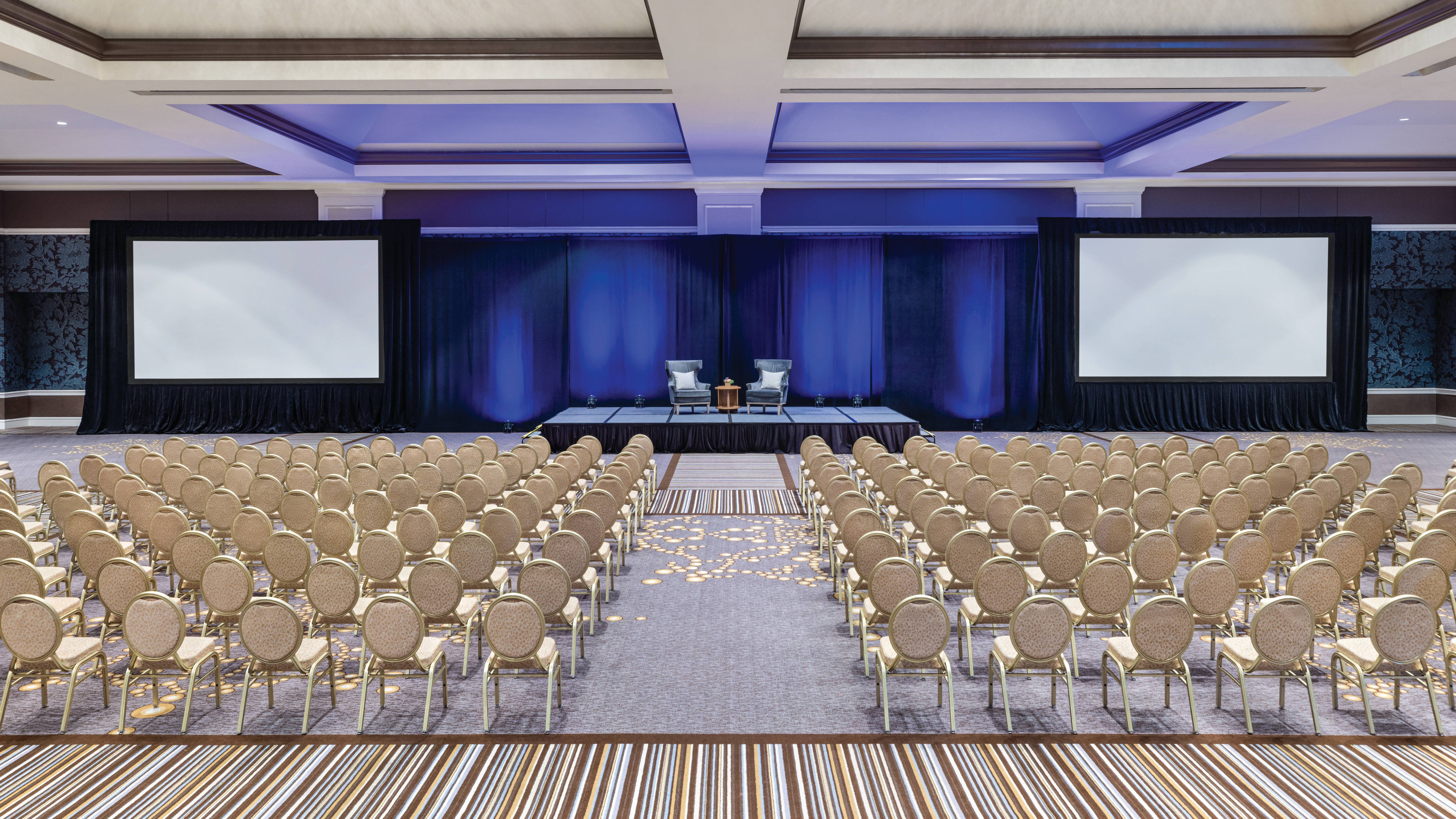 large ballroom with rows of chairs