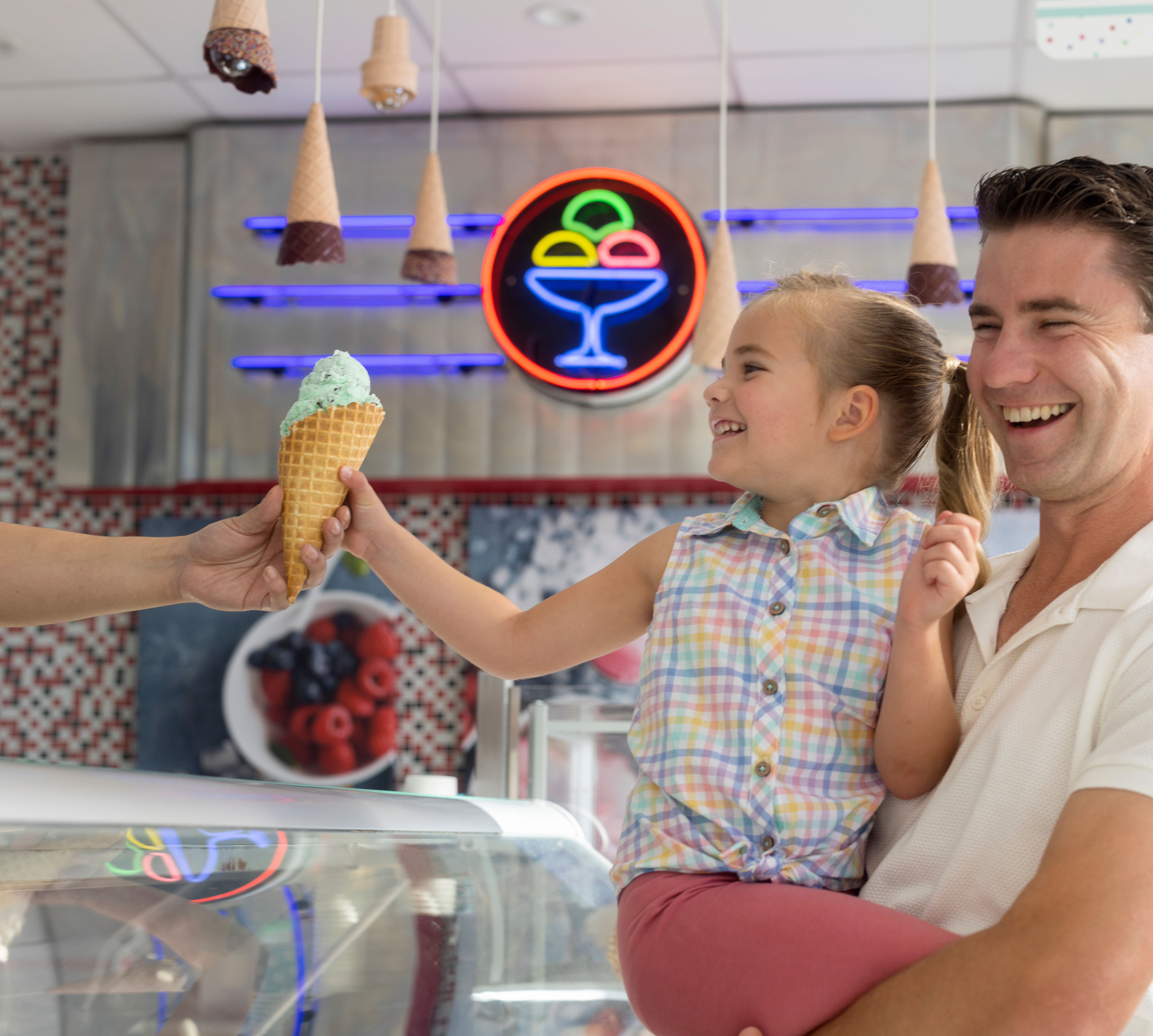 Father and Daughter Enjoying  Ice Cream at Sundaes