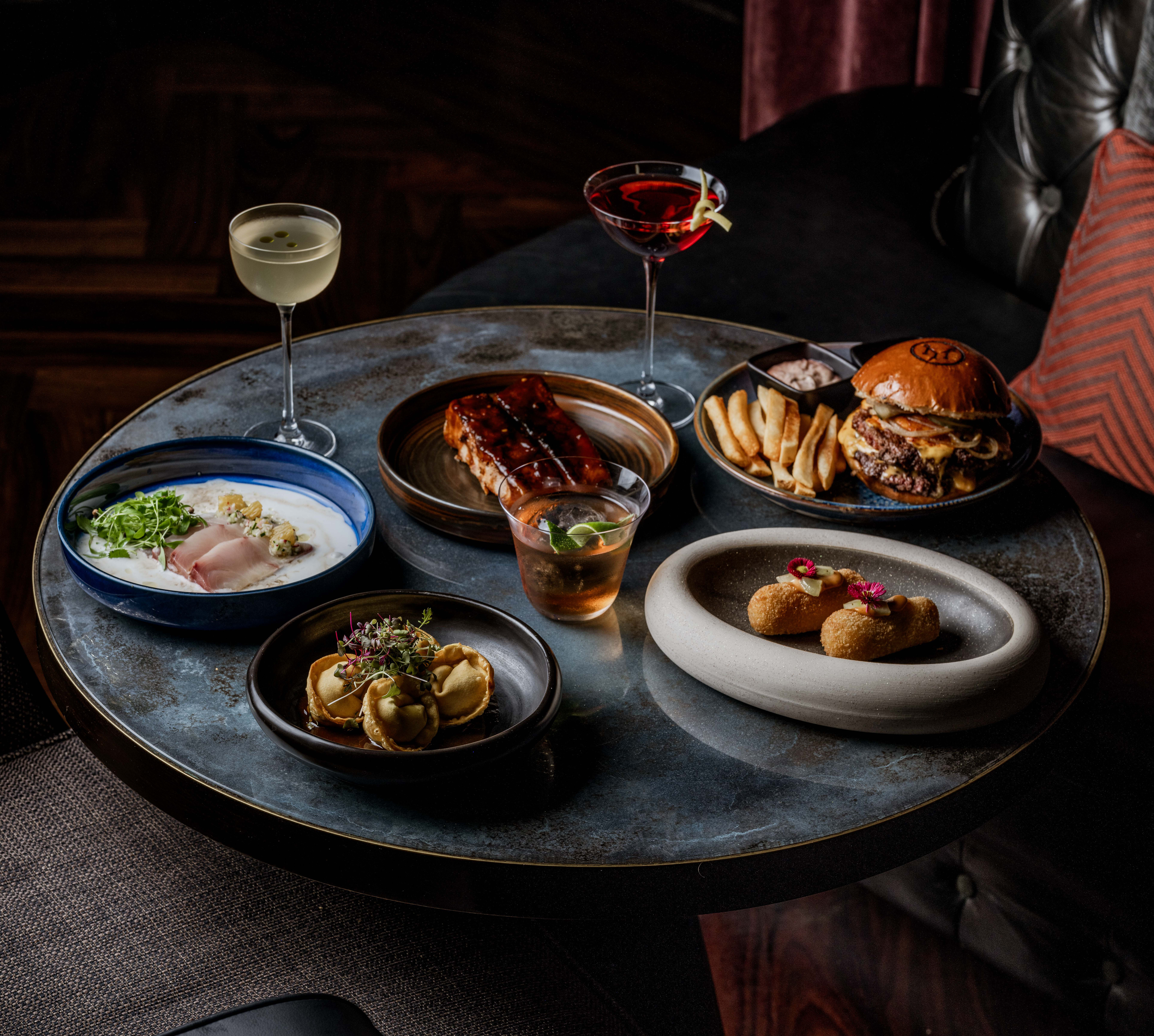 Table and chair setup with array of food and drink