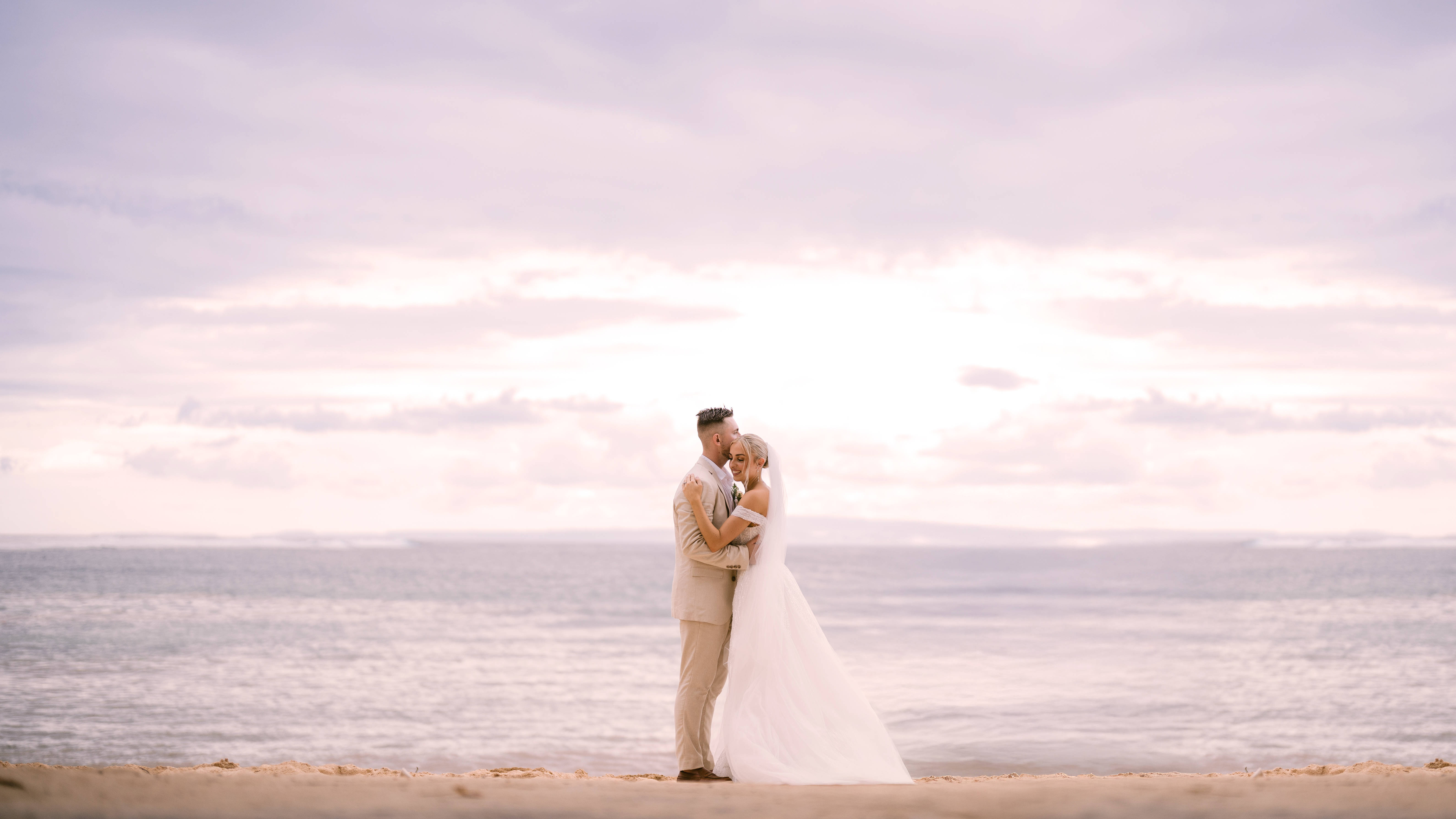 Couple Celebrating Their Wedding at the Beach