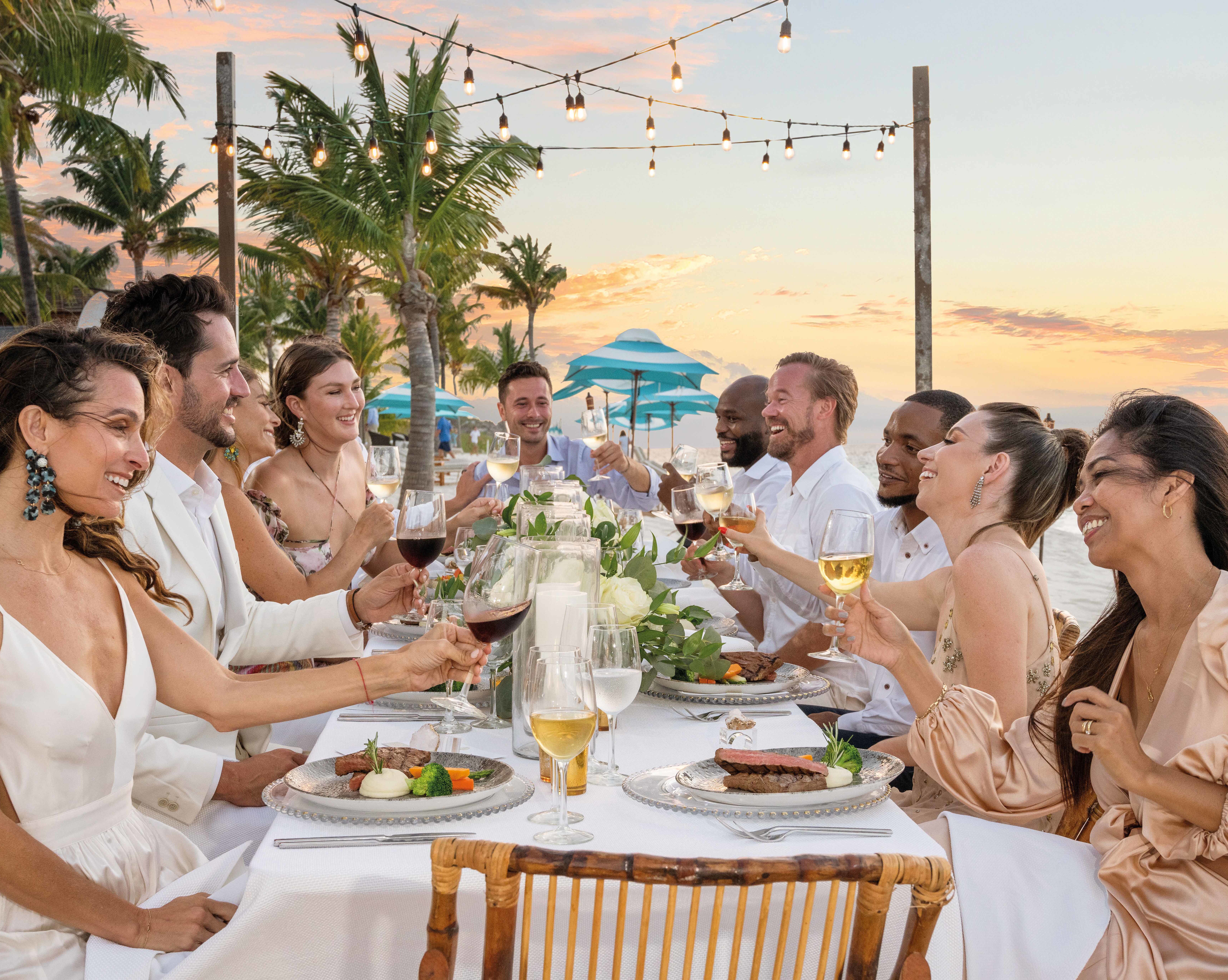 Beach table setup with wedding guests-transition