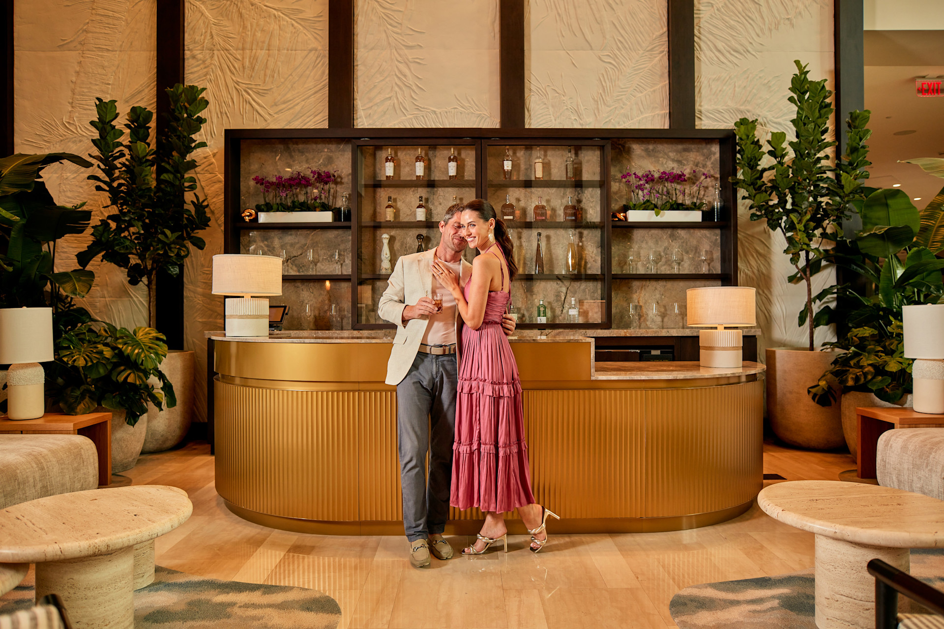 Stylish adult couple sharing a relaxed moment in a premium hotel bar
