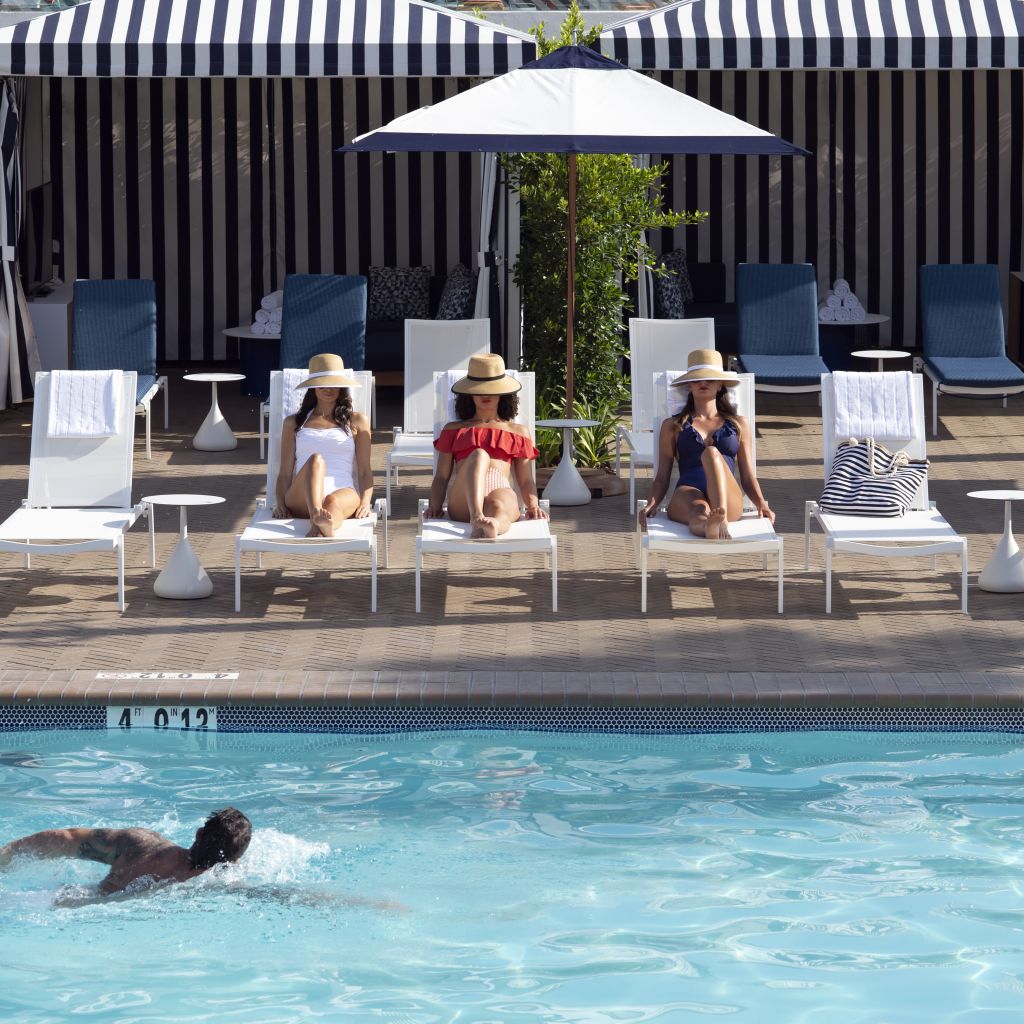 Women at side of Pool on Loungers