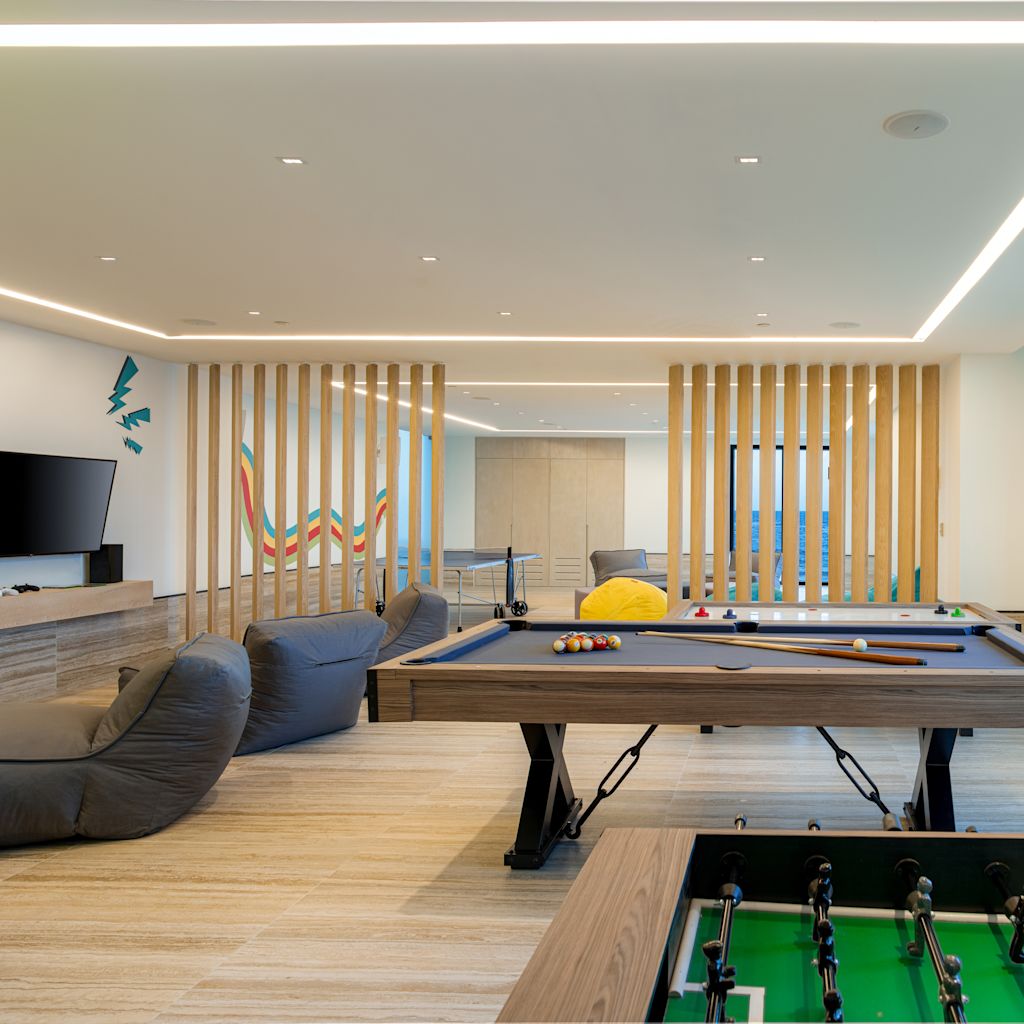 indoor game center with billiards and gaming console