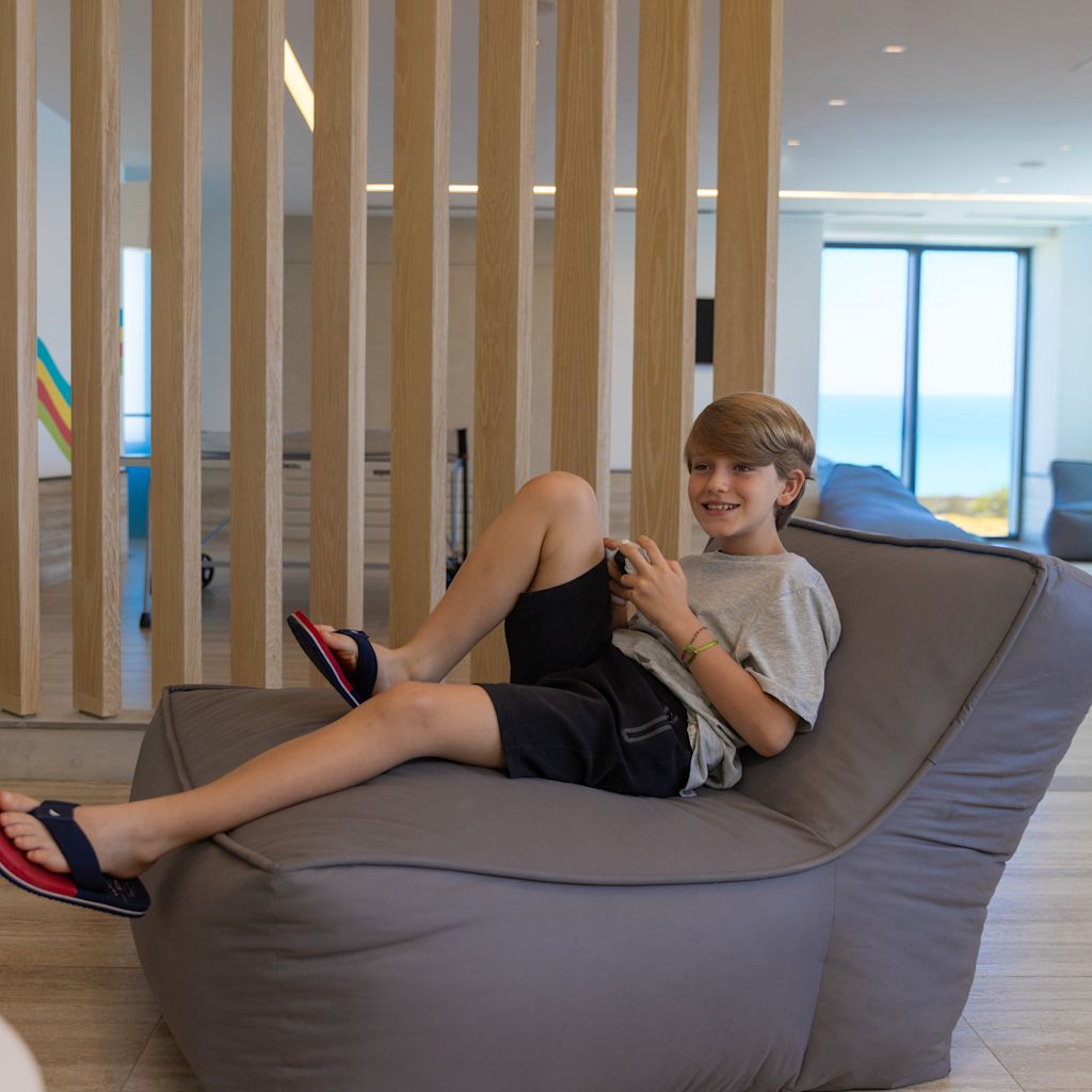 boy lounging in chair