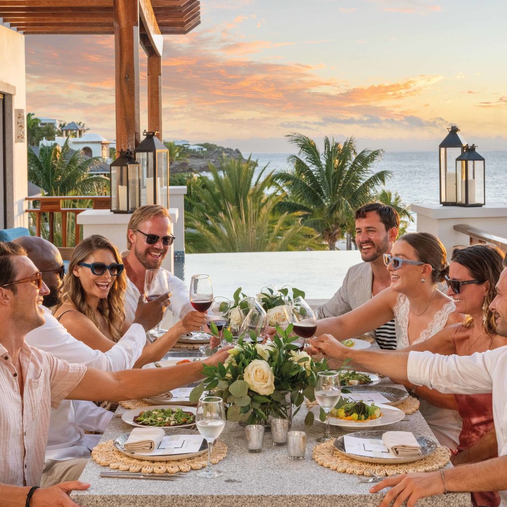 Wedding guests on dining table balcony