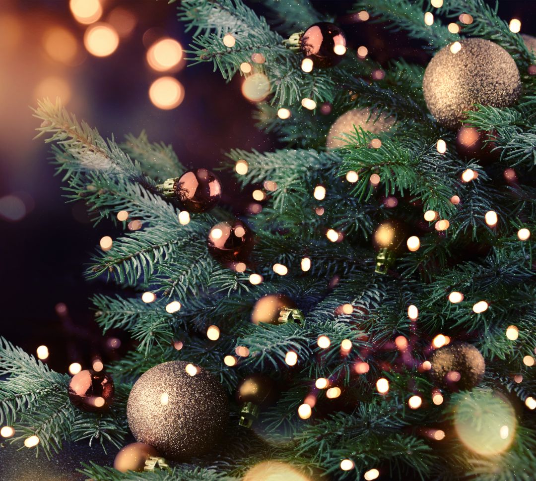Closeup of a Christmas tree with golden baubles