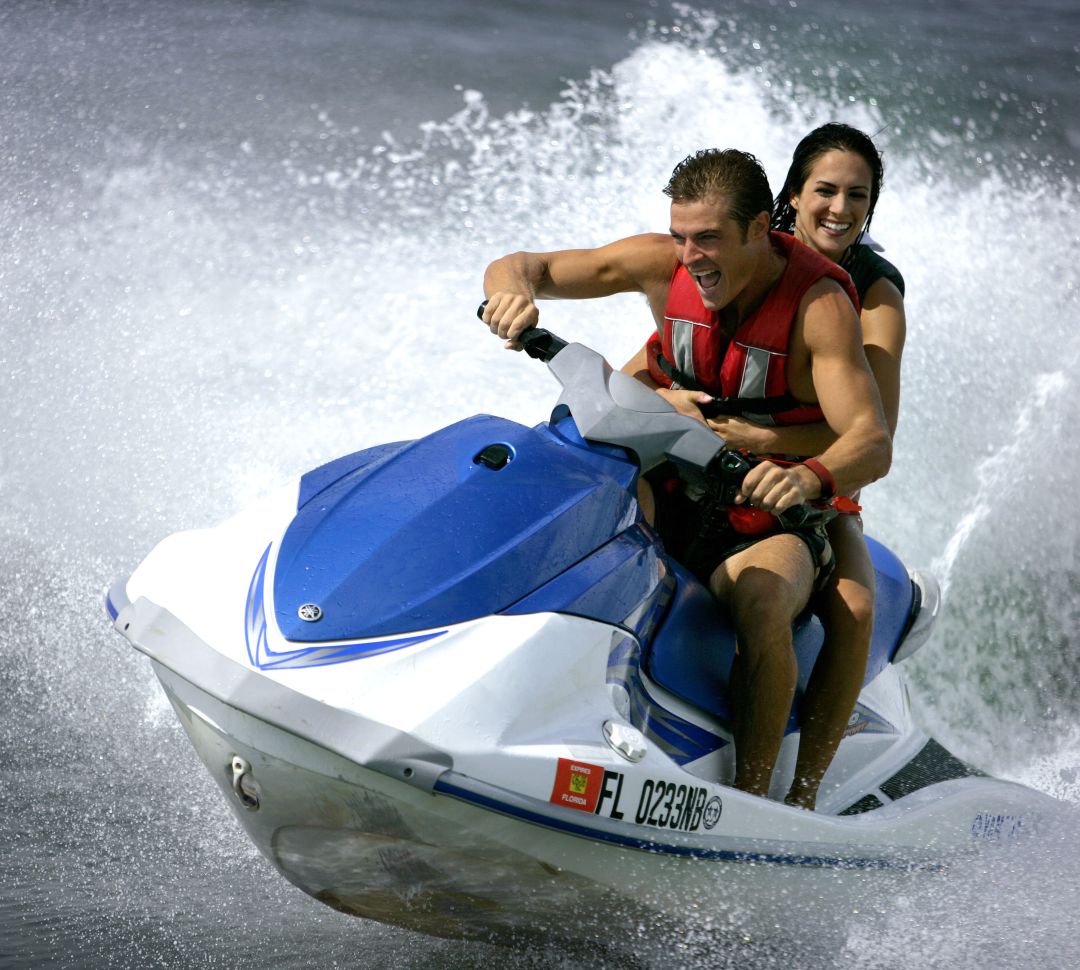 guests riding on a jet ski