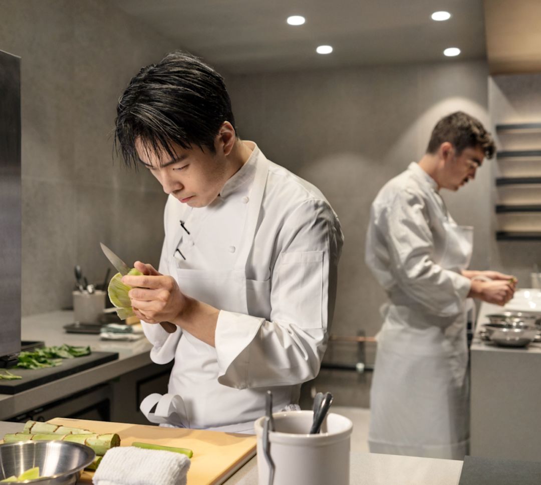 Chef Dae Kim and Chef De Cuisine Aaron Whittle, preparing entrees
