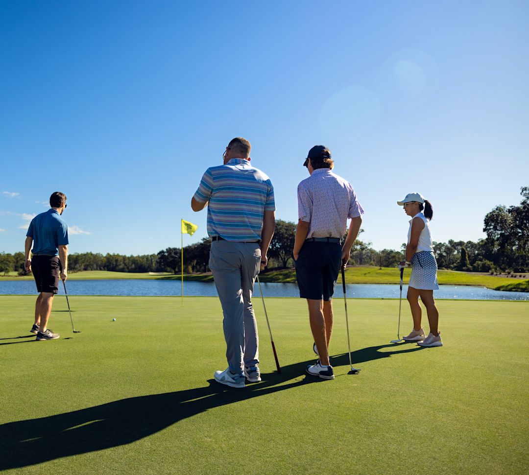 A group of people Golfing on Golf course