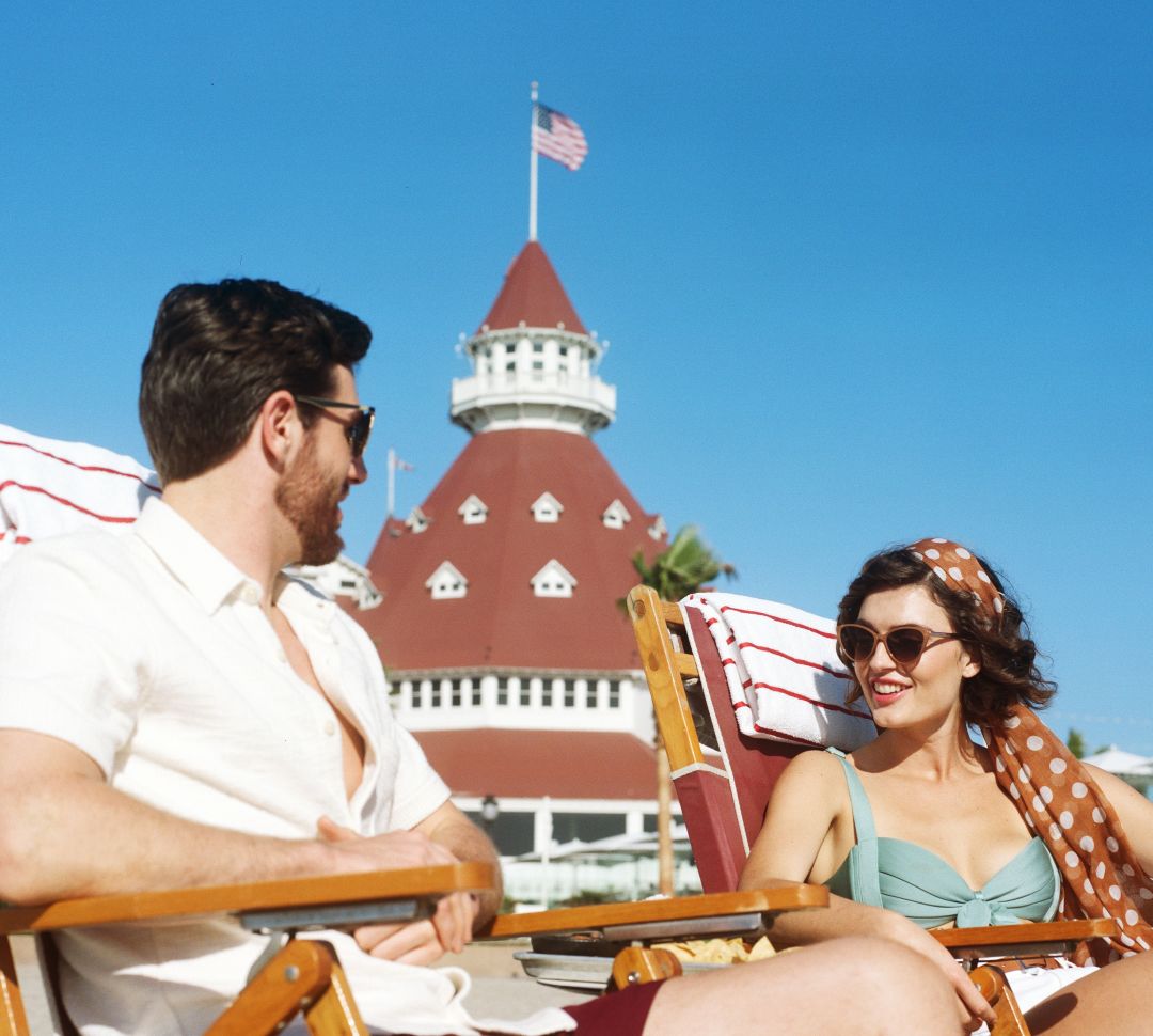 couple conversing and relaxing at the beach