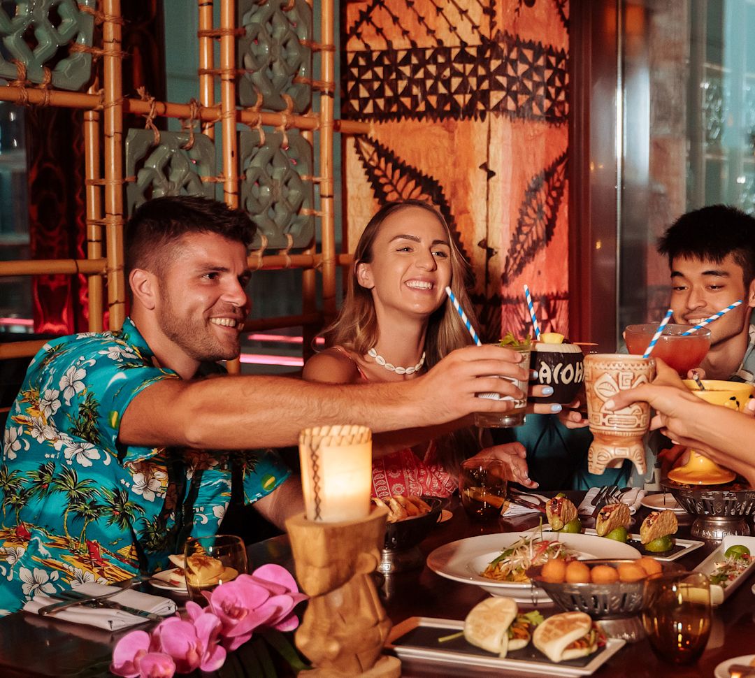 a group of people sitting at a table in a restaurant having brunch