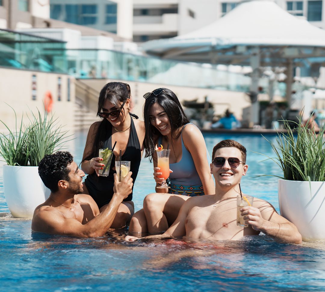 a Group of People Having Drinks at Zing Pool and Beach