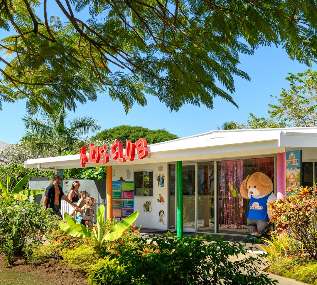 A family entering the Kids Club.-transition