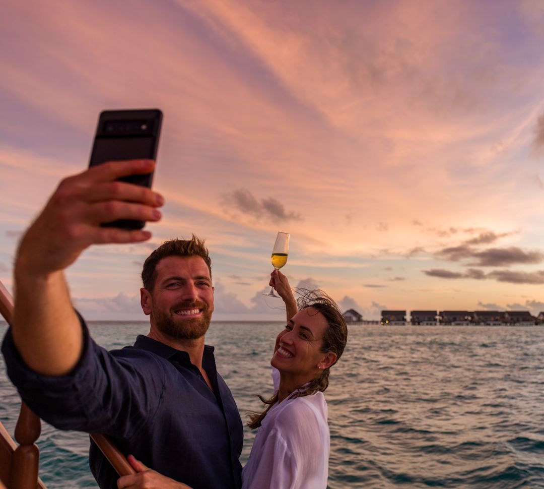 Couple Taking A Seflie Photo by the Ocean