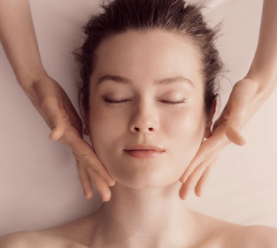 Woman Enjoying a Facial at Spa Guerlain