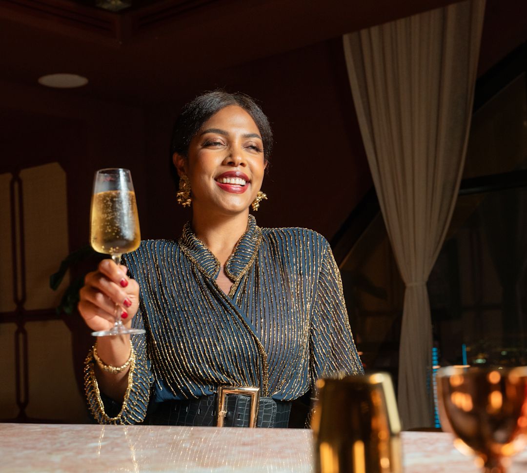 guest enjoying a glass of wine at Yun bar