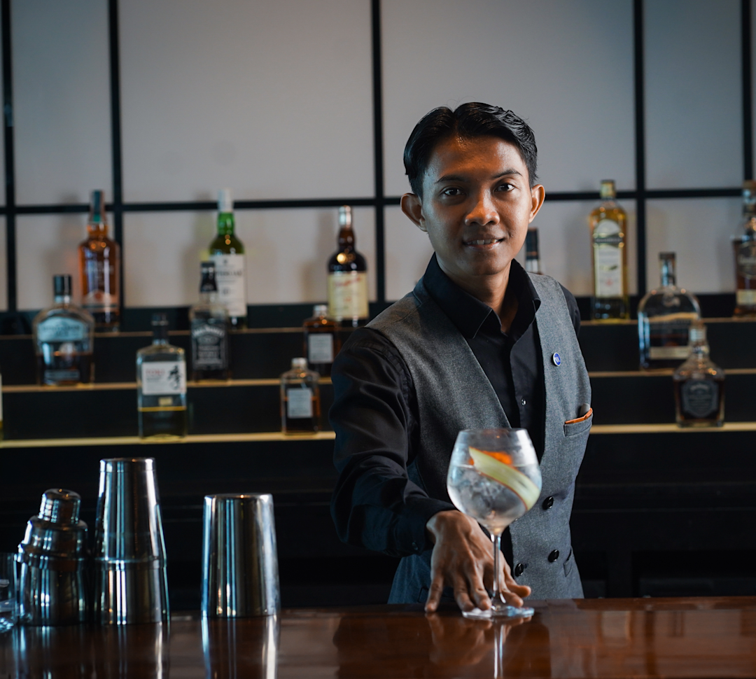 bartender serving a cocktail