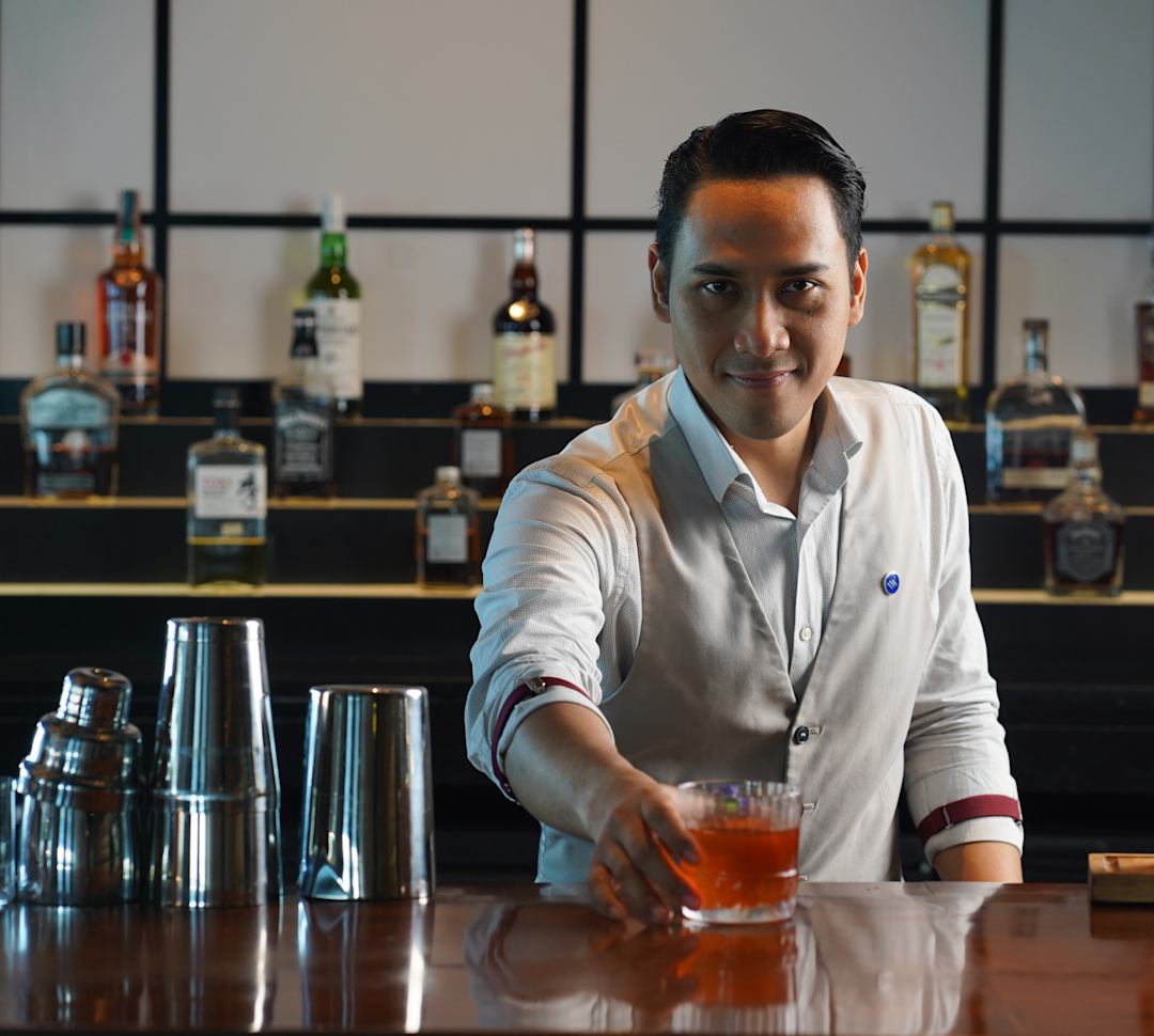 bartender serving a cocktail