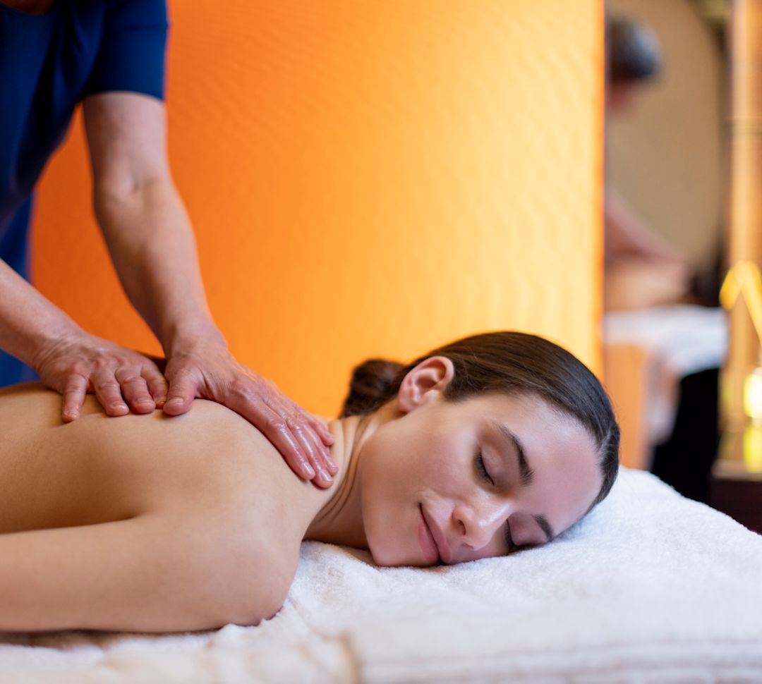 Woman receiving back massage